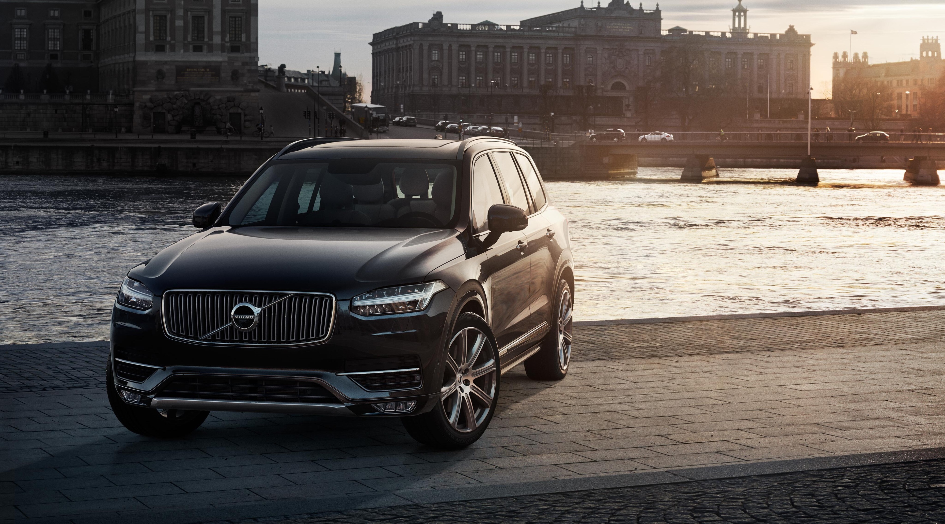 Black Volvo XC90 parked by a river in Stockholm HD Wallpaper