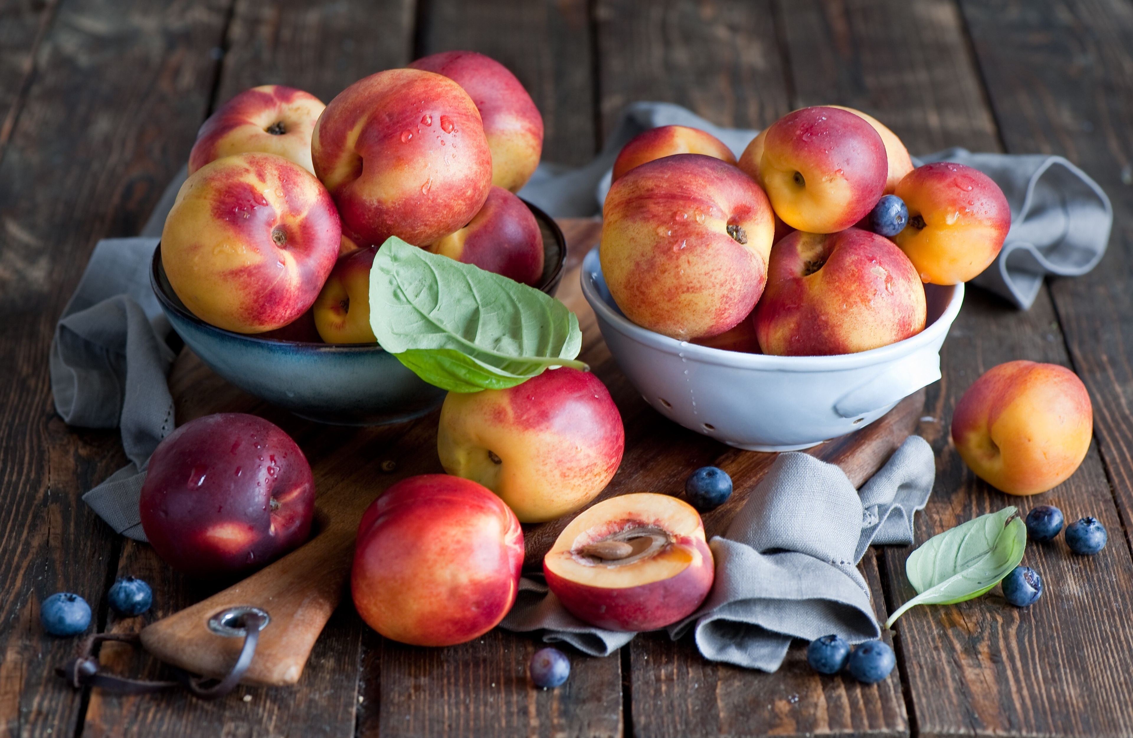 Nectarines and blueberries on wooden table HD Wallpaper