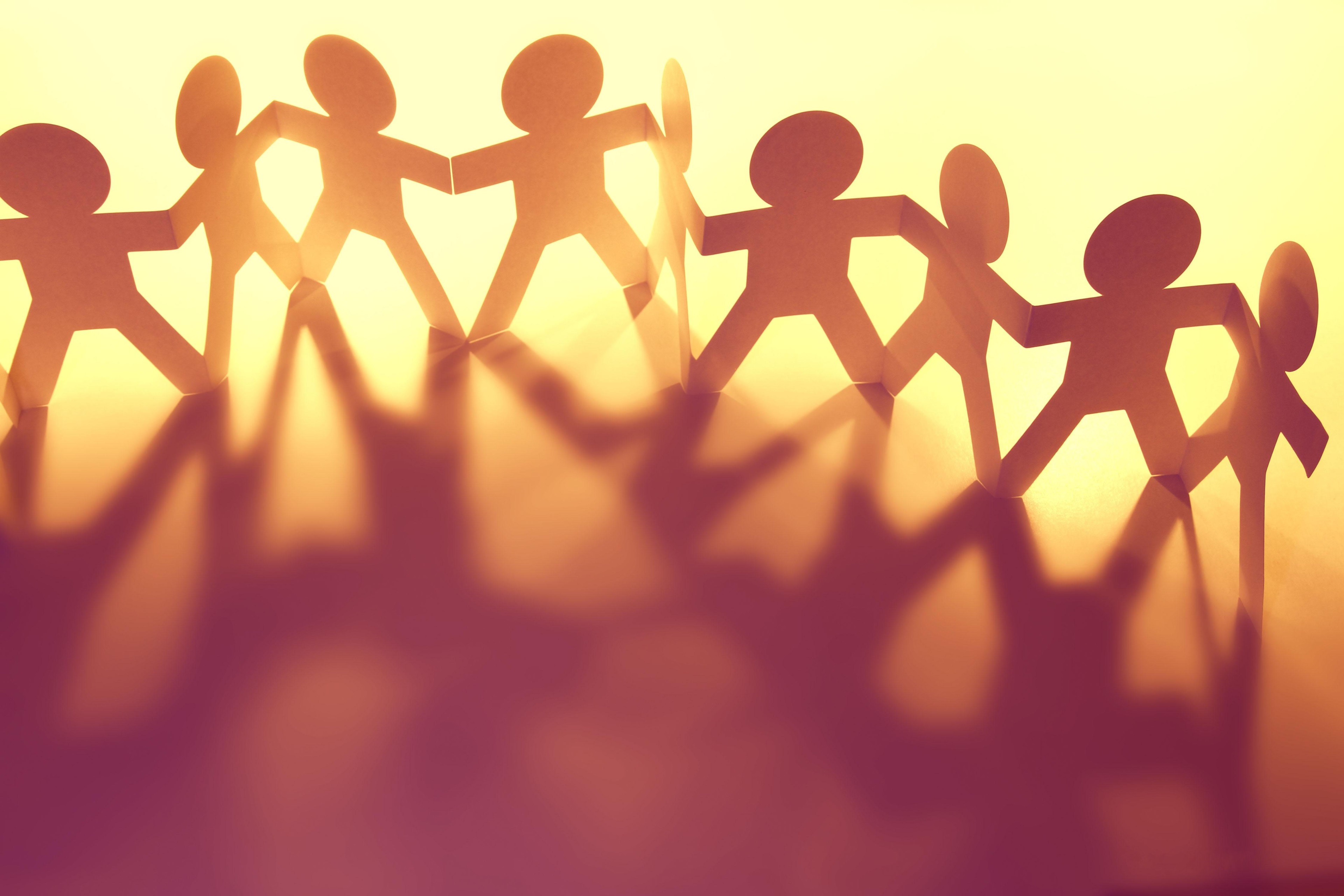 Paper chain people holding hands with shadows HD Wallpaper