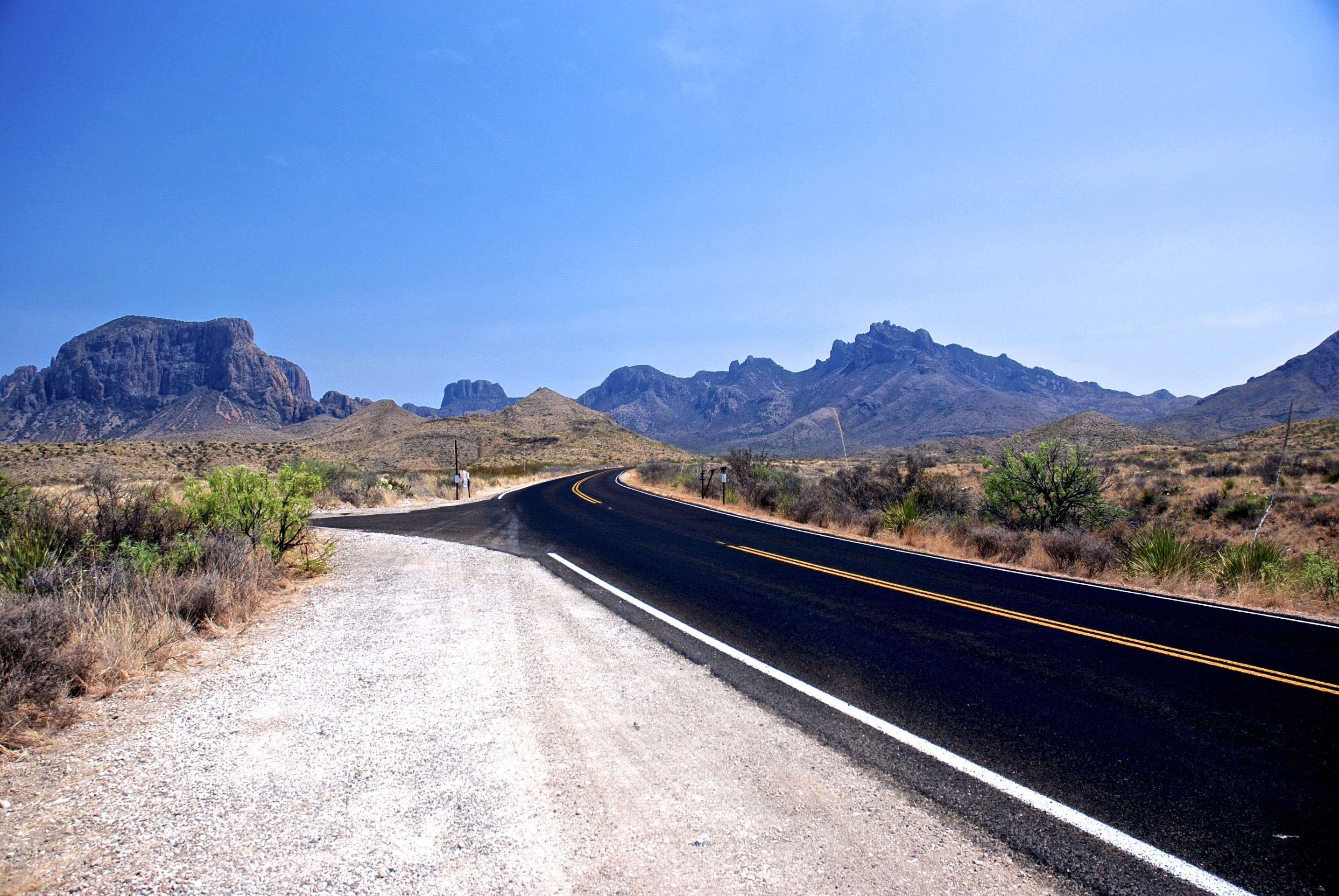 Desert road through mountains in Big Bend National Park, Texas HD Wallpaper