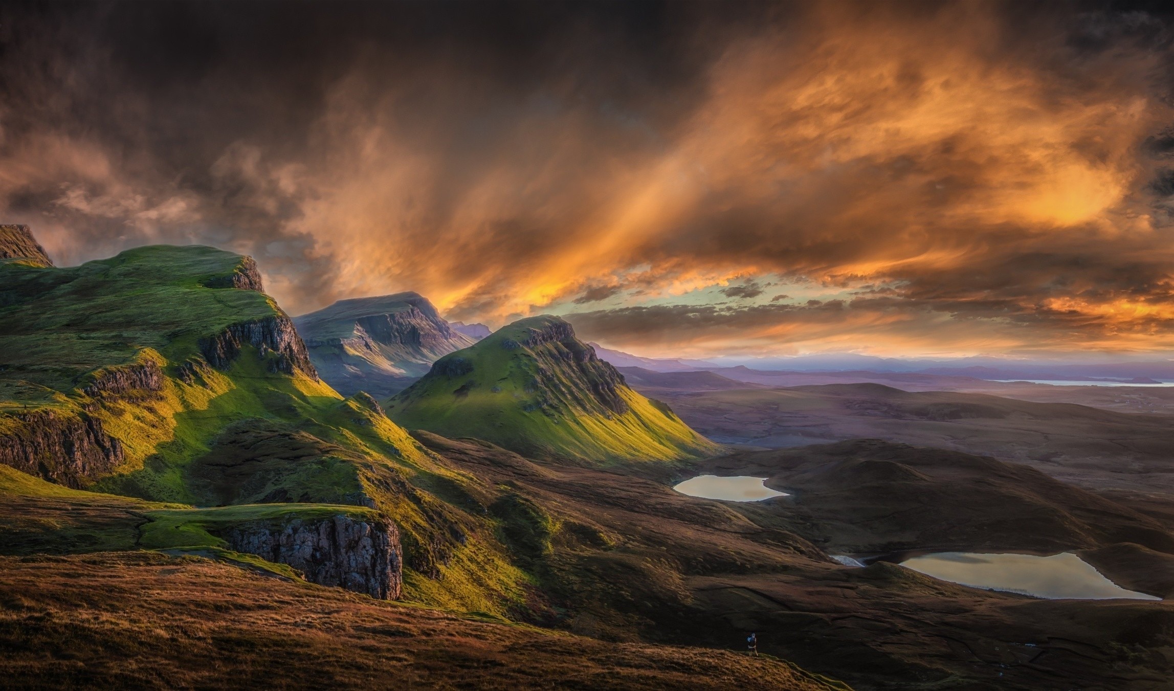 Mountain landscape in Scotland at sunrise with dramatic clouds HD Wallpaper
