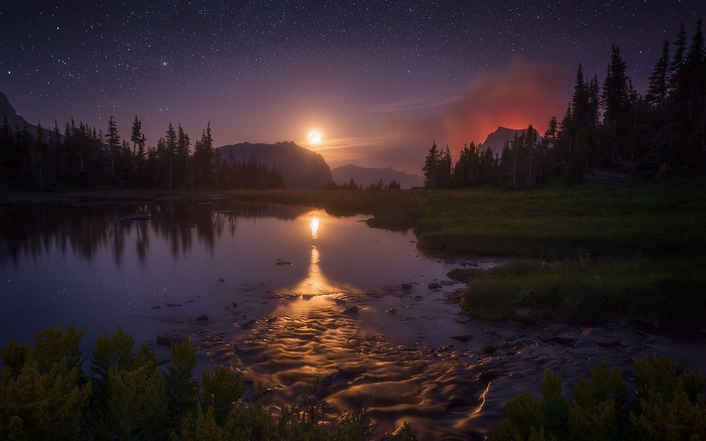 Starry night over a lake with a moonlit mountain and wildfire HD Wallpaper