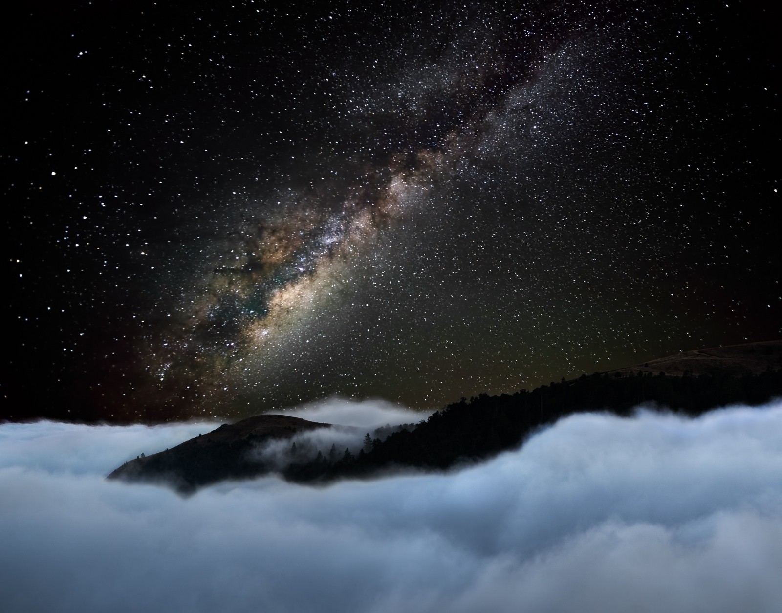 Milky Way over misty mountains and forest HD Wallpaper