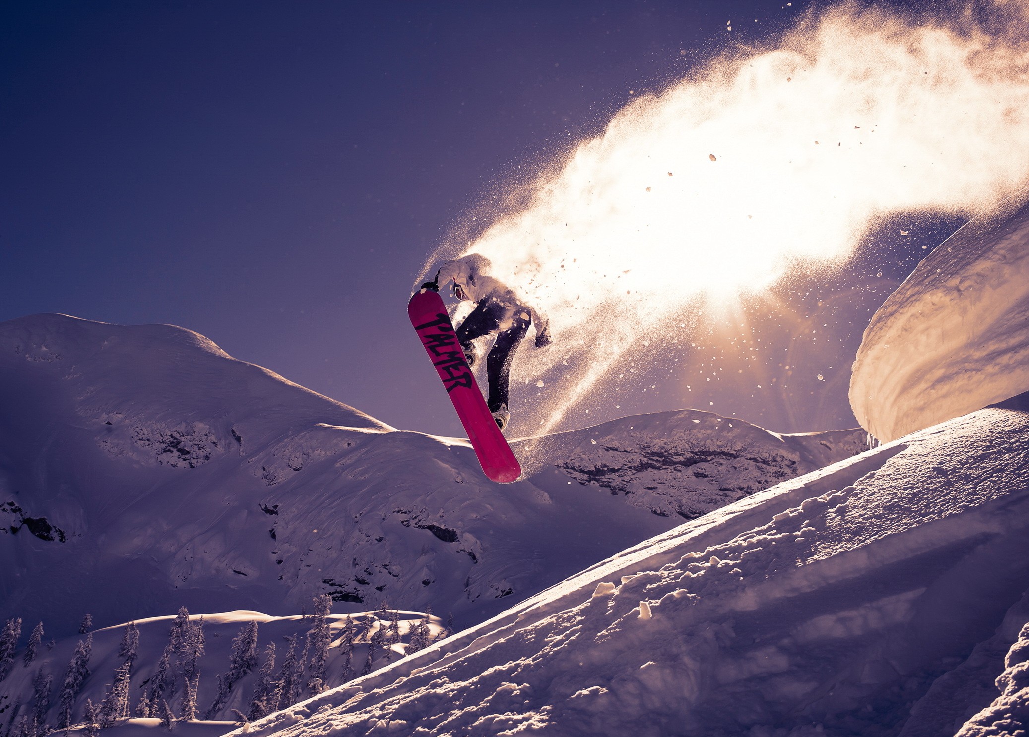 Snowboarder jumping in snowy mountains HD Wallpaper