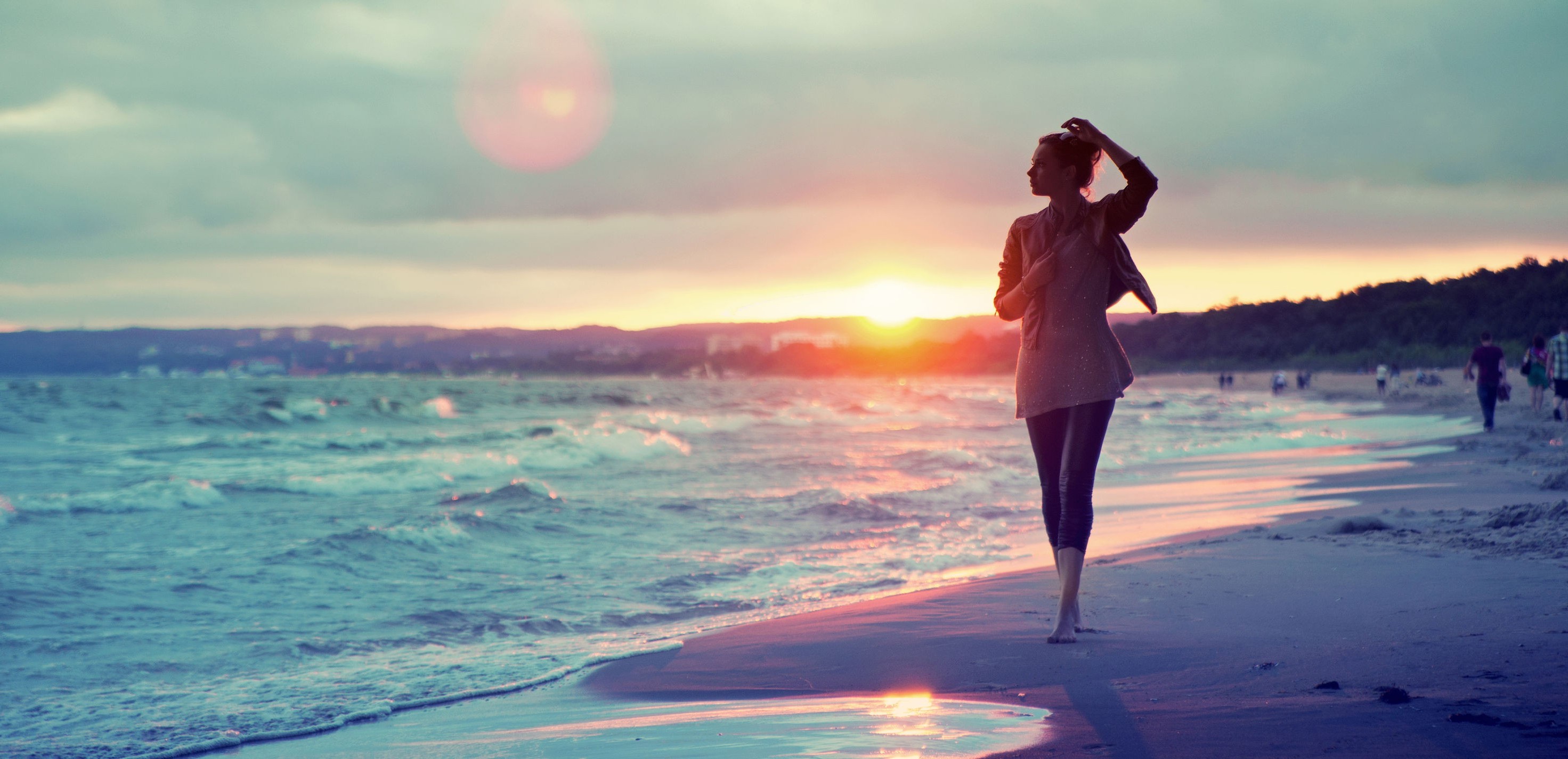 Woman walking on beach at sunset HD Wallpaper