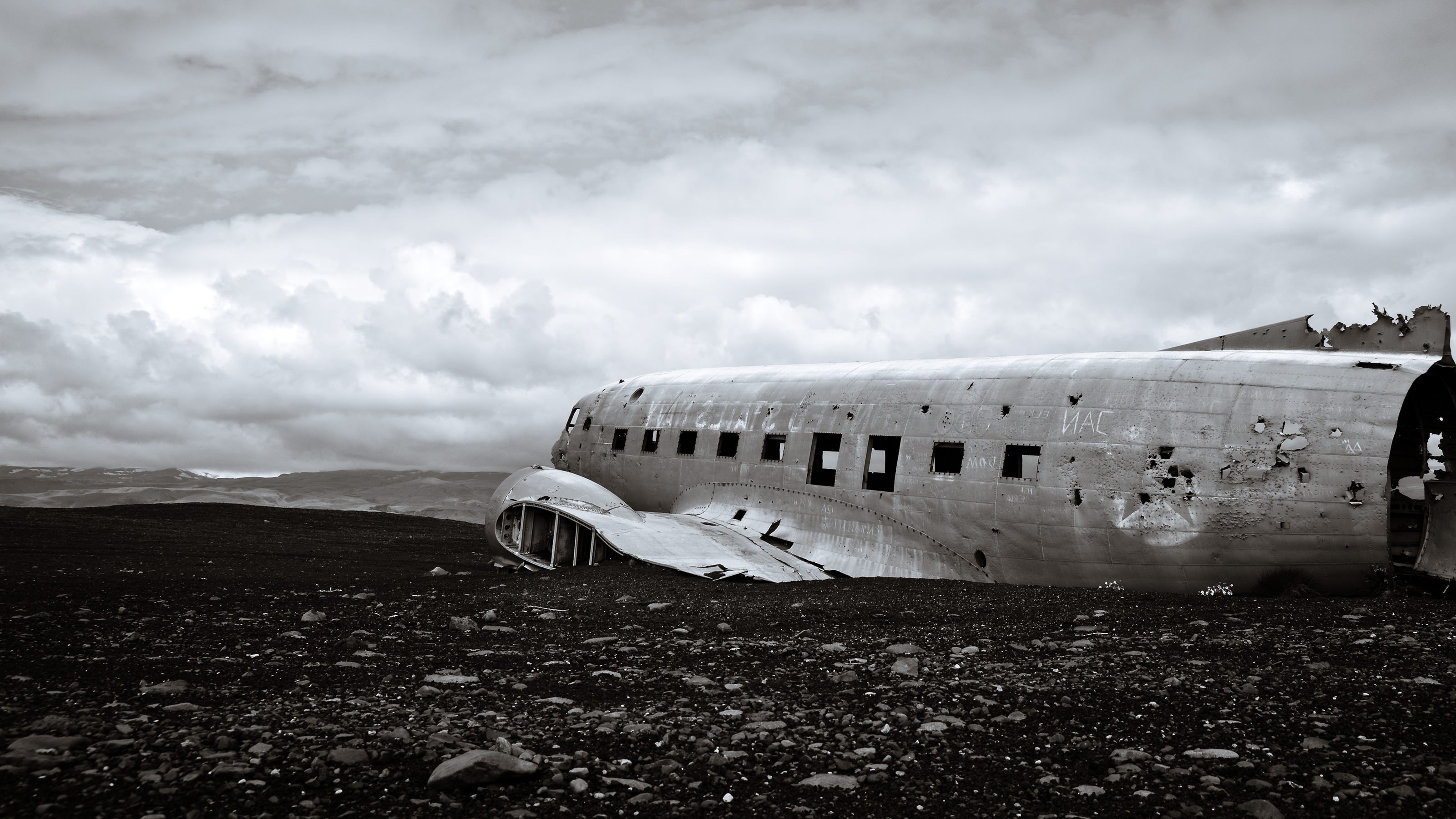 Wrecked airplane on a black sand beach in Iceland HD Wallpaper