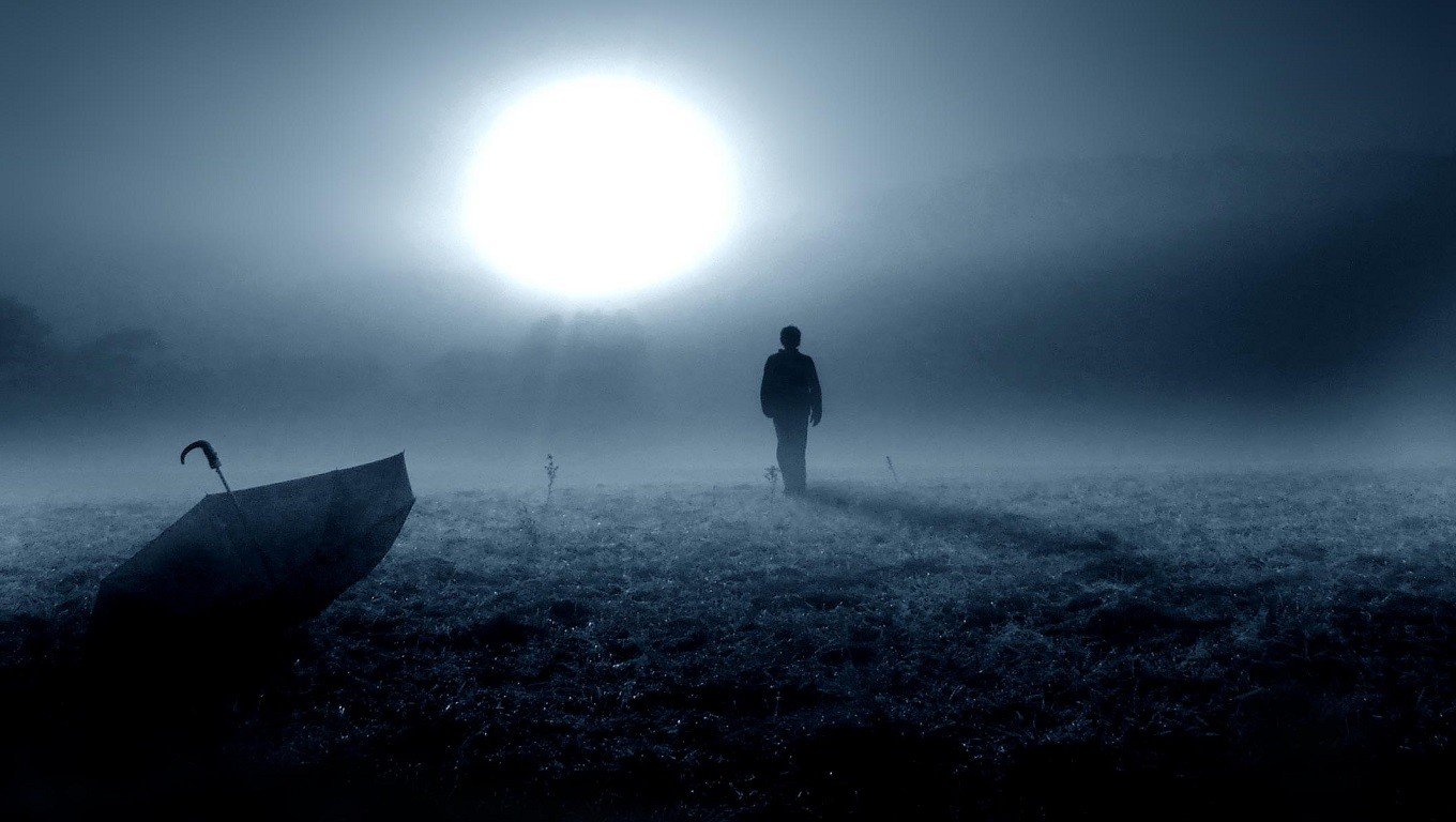 Man walking in fog with umbrella HD Wallpaper
