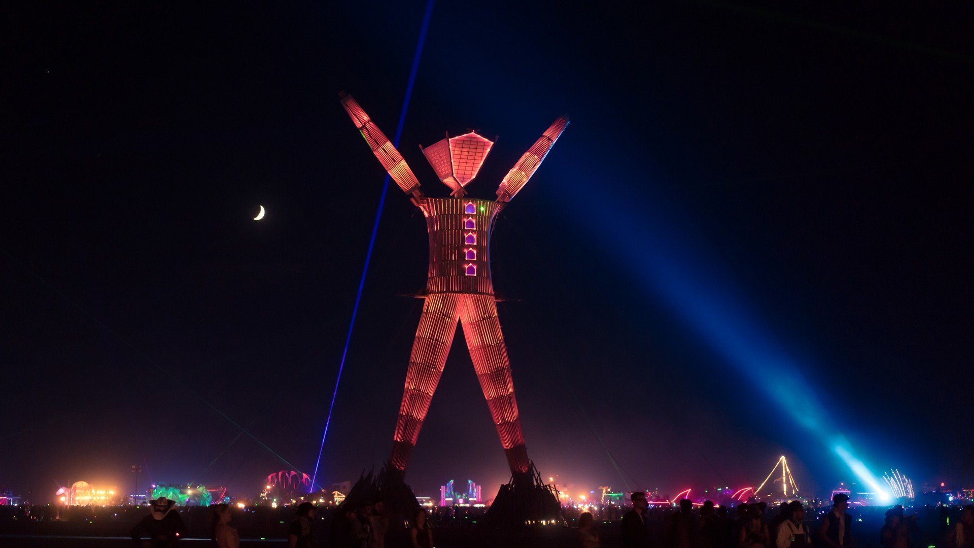 The Man at Burning Man festival at night HD Wallpaper