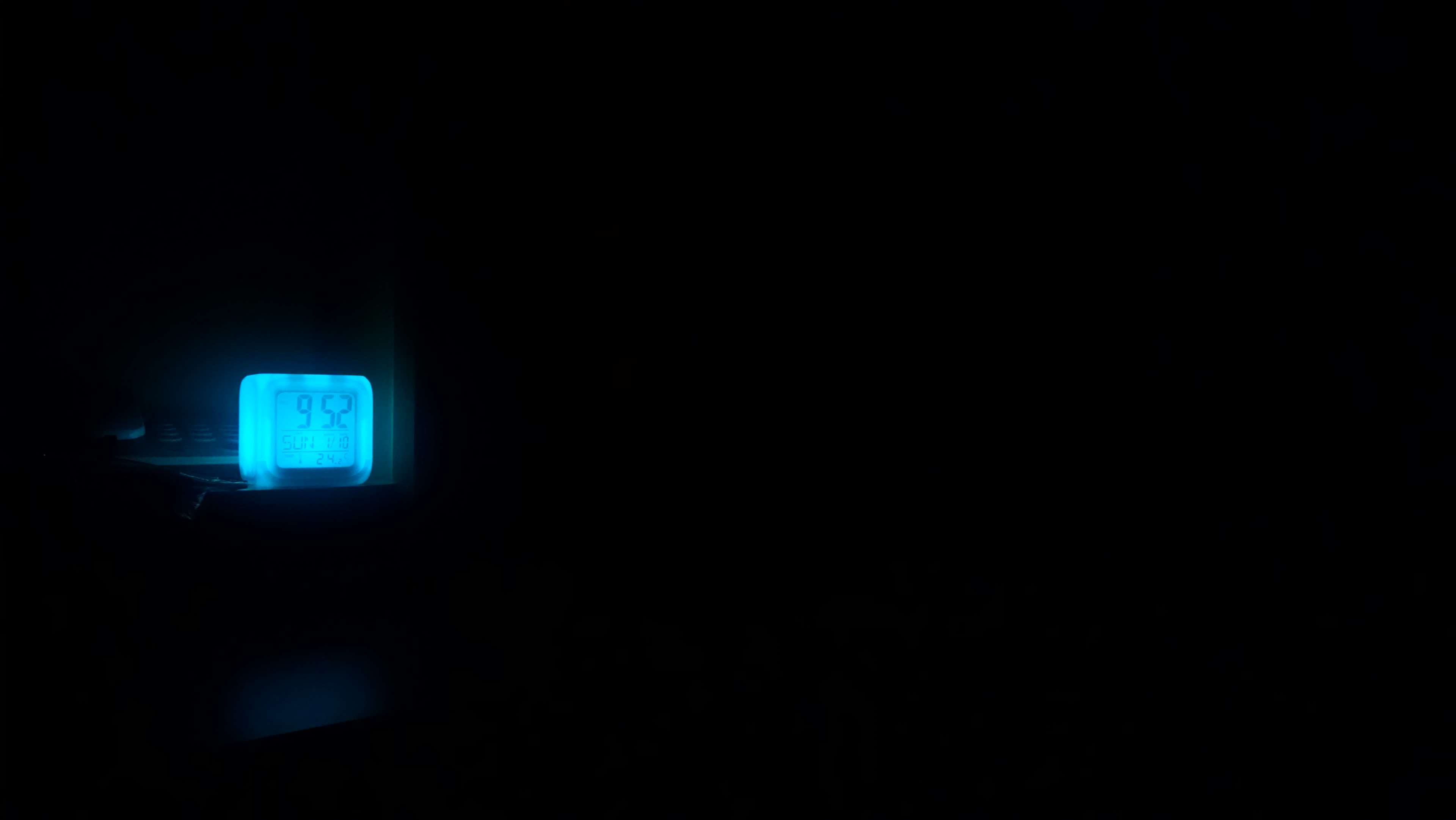 Minimalist glowing alarm clock at night 4K HD Wallpaper