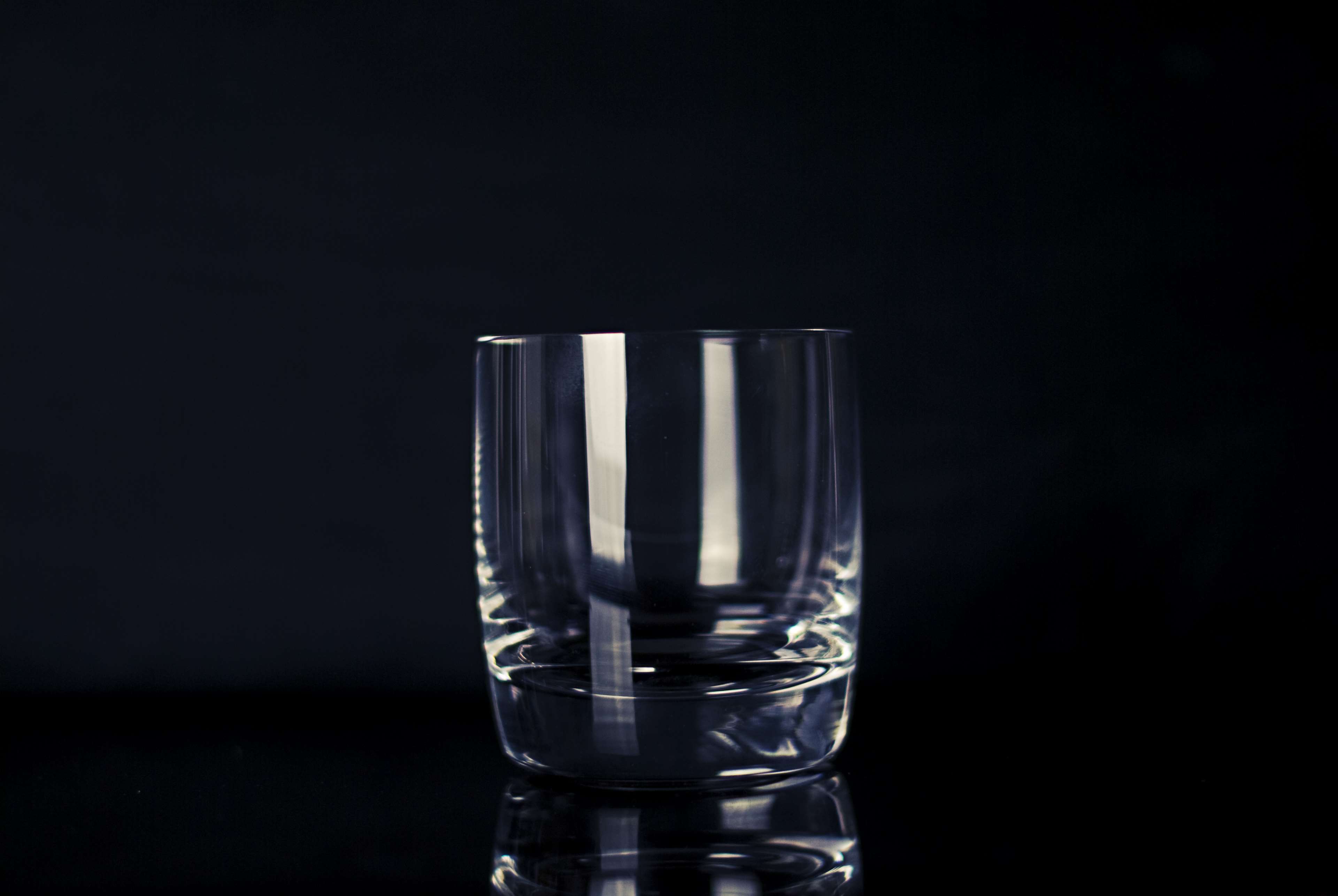 Empty crystal glass on black background HD Wallpaper