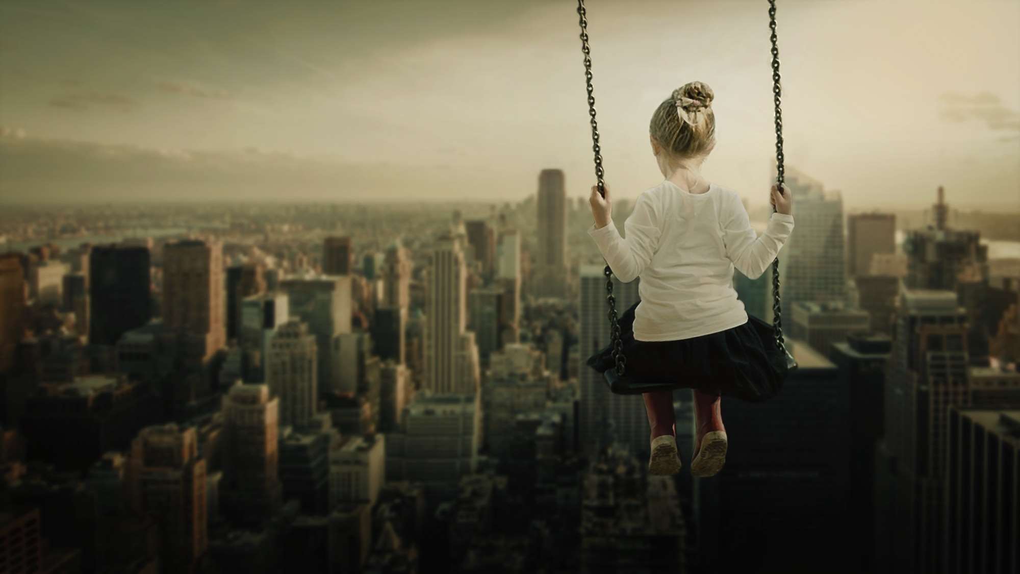 Girl on a swing overlooking a surreal cityscape HD Wallpaper