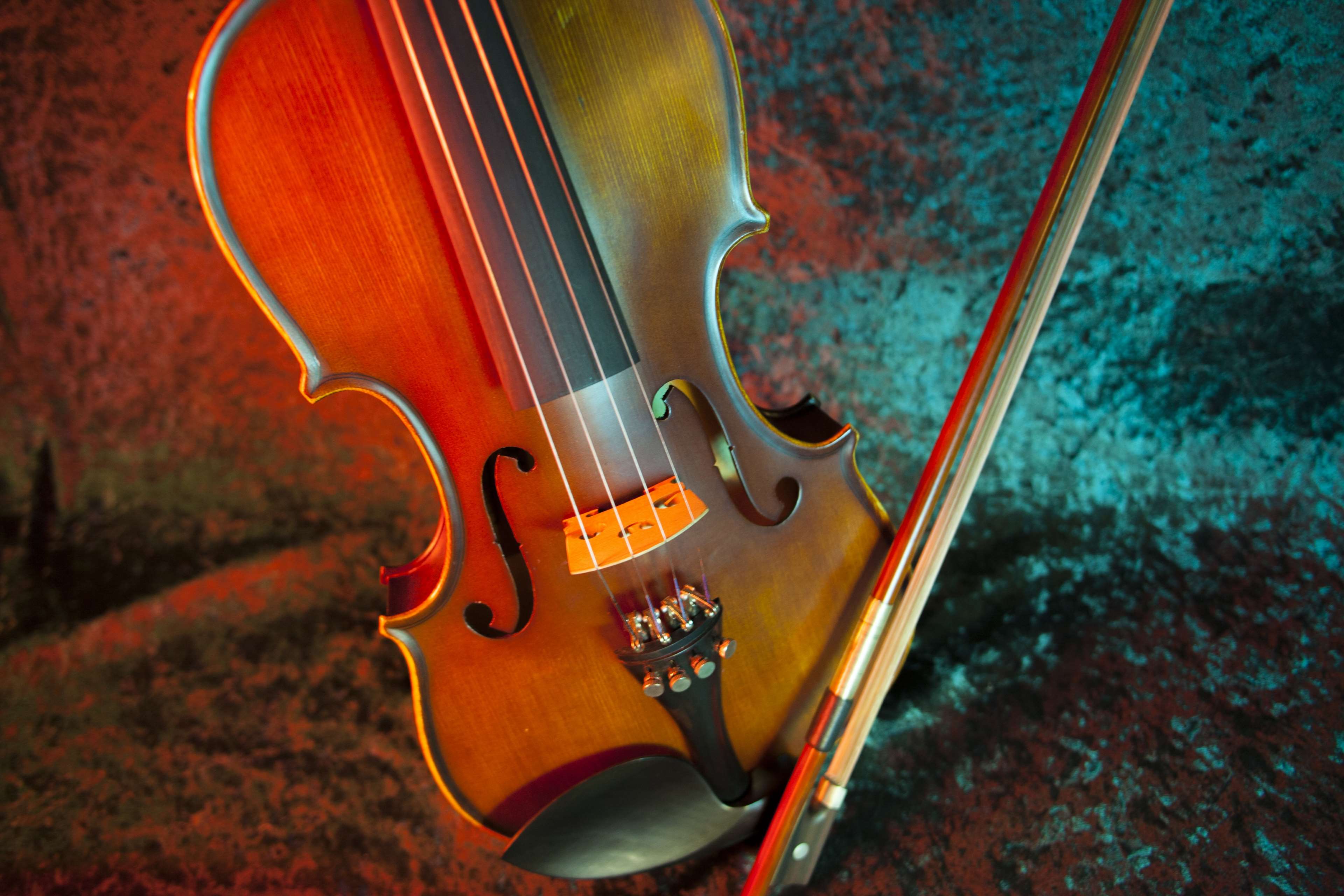 Violin and Bow on Textured Background 4K HD Wallpaper