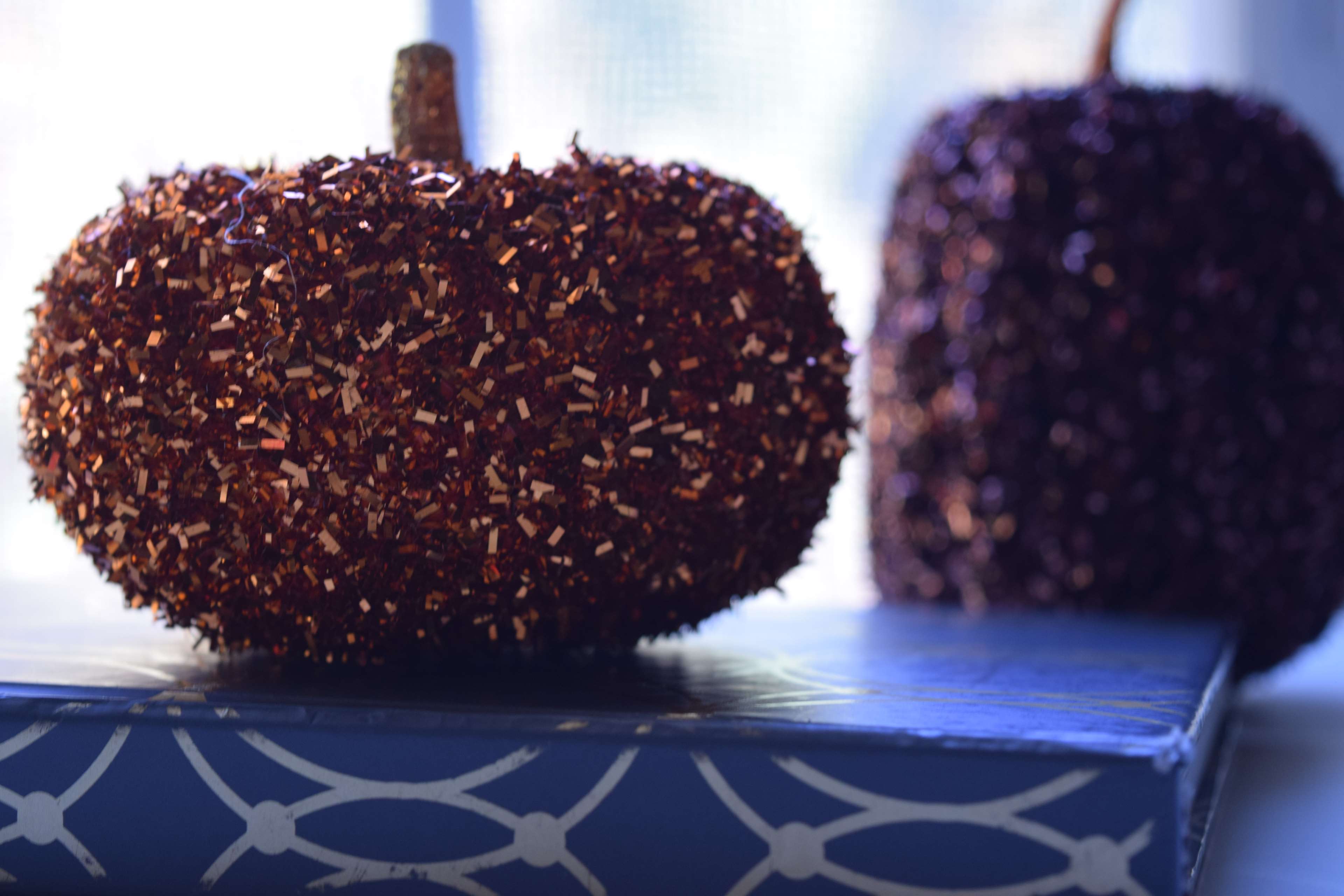 Sparkly pumpkins on a book HD Wallpaper