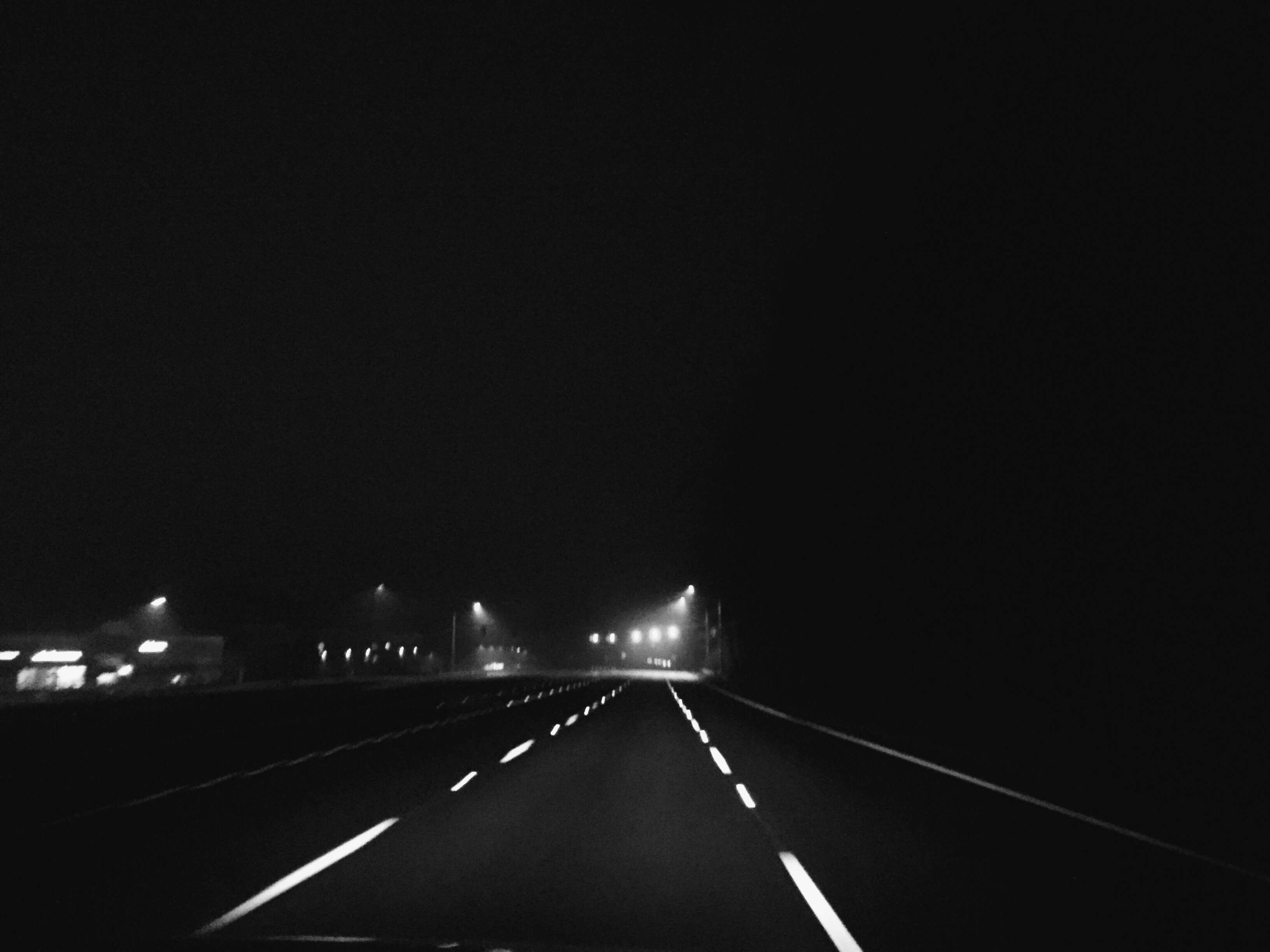 Empty road at night with streetlights HD Wallpaper