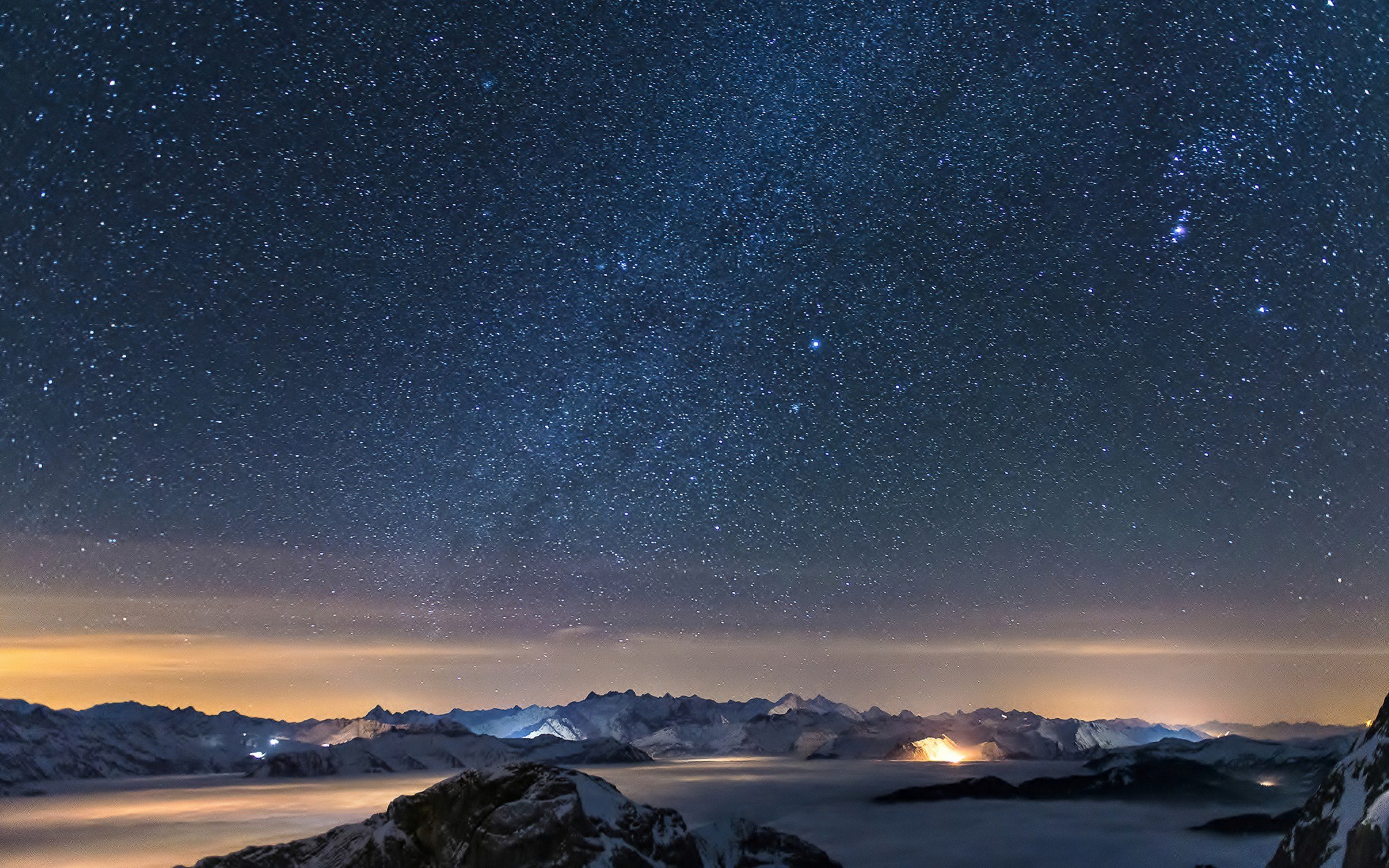 Starry night sky over foggy mountains HD Wallpaper