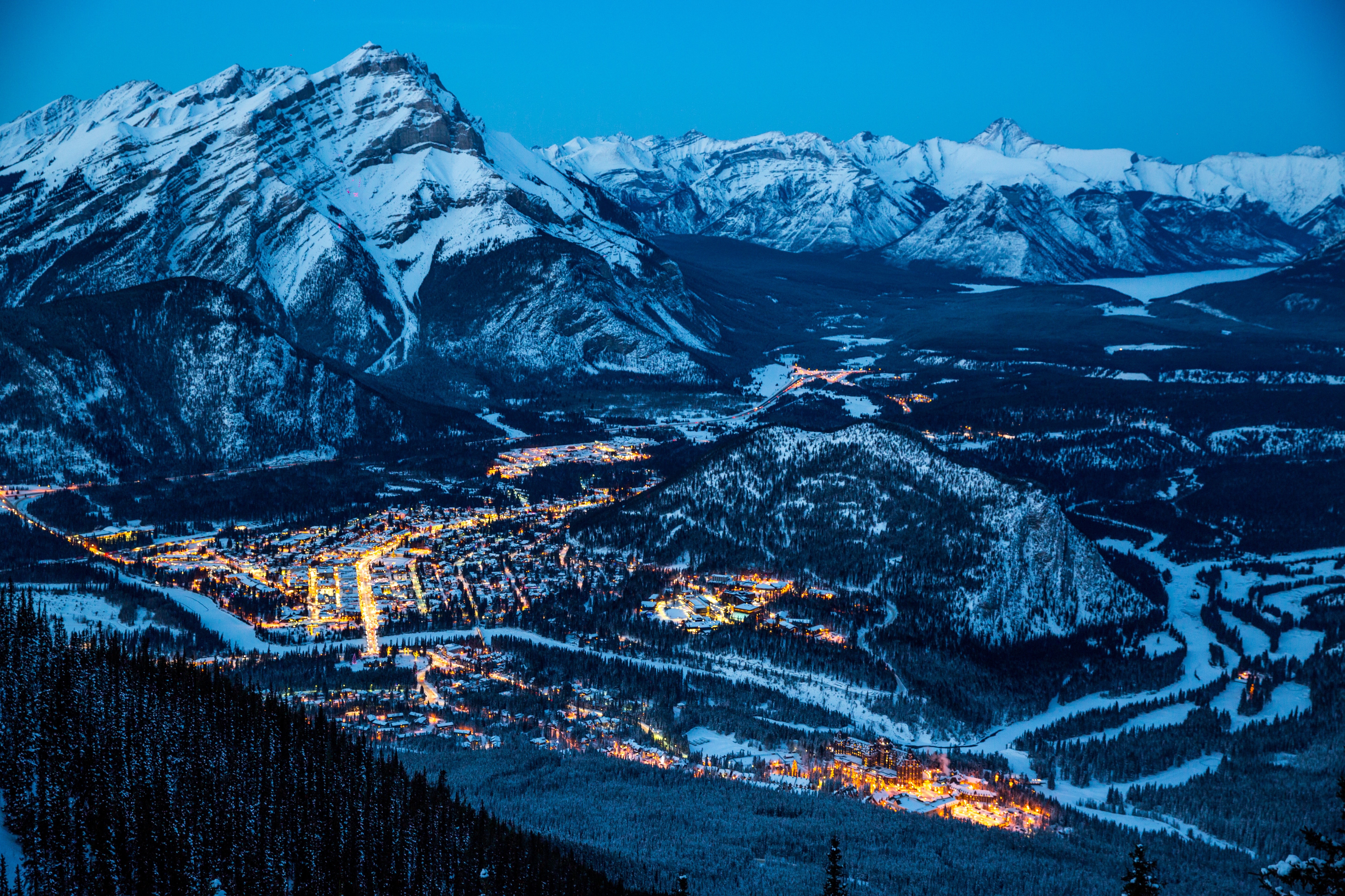Banff, Canada at night with snow-covered mountains HD Wallpaper