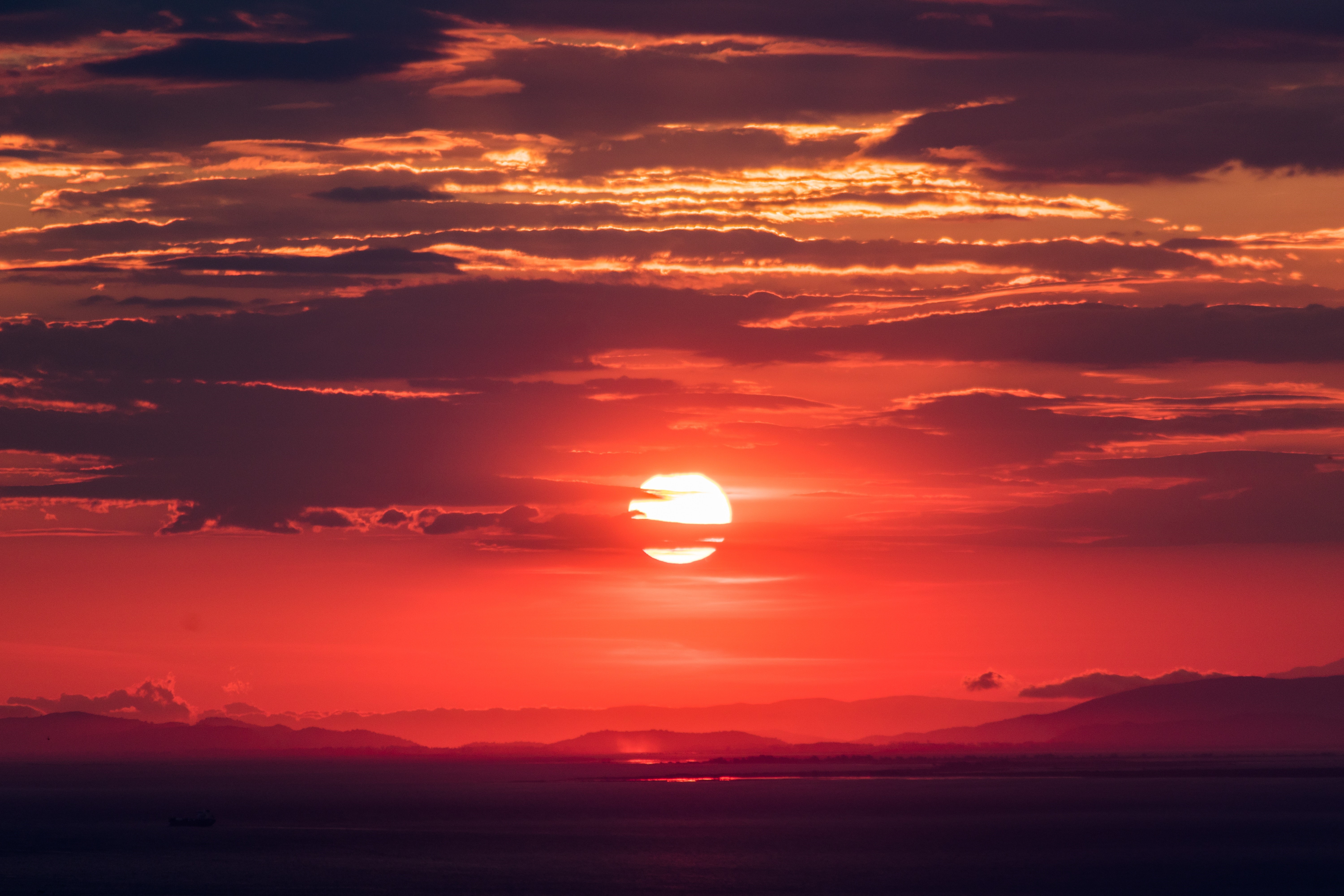 Fiery Red Sunset Over Calm Sea and Mountains HD Wallpaper