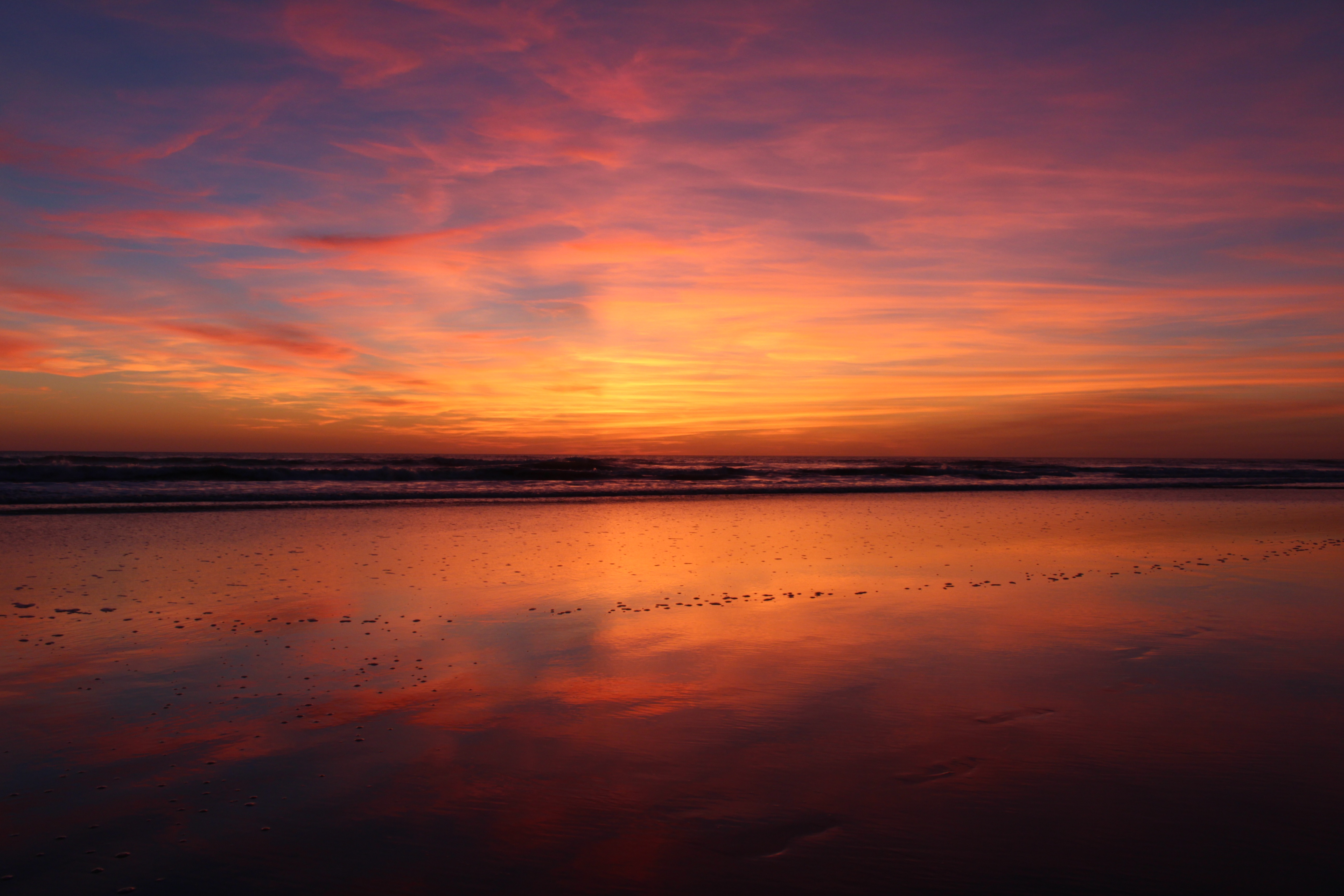 Beach sunset with colorful clouds and reflections HD Wallpaper