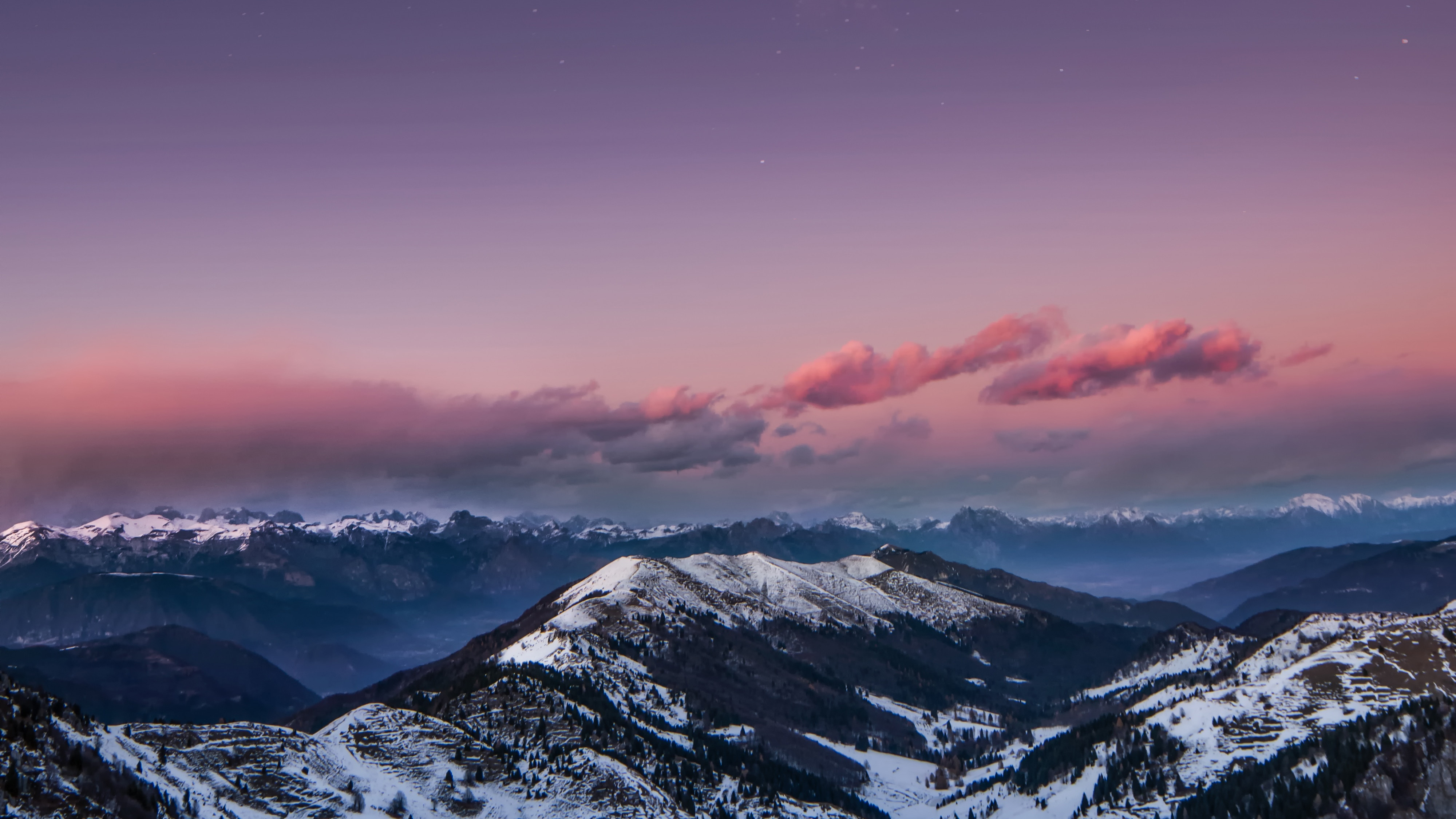 Snowy mountains at dusk with pink clouds and stars HD Wallpaper