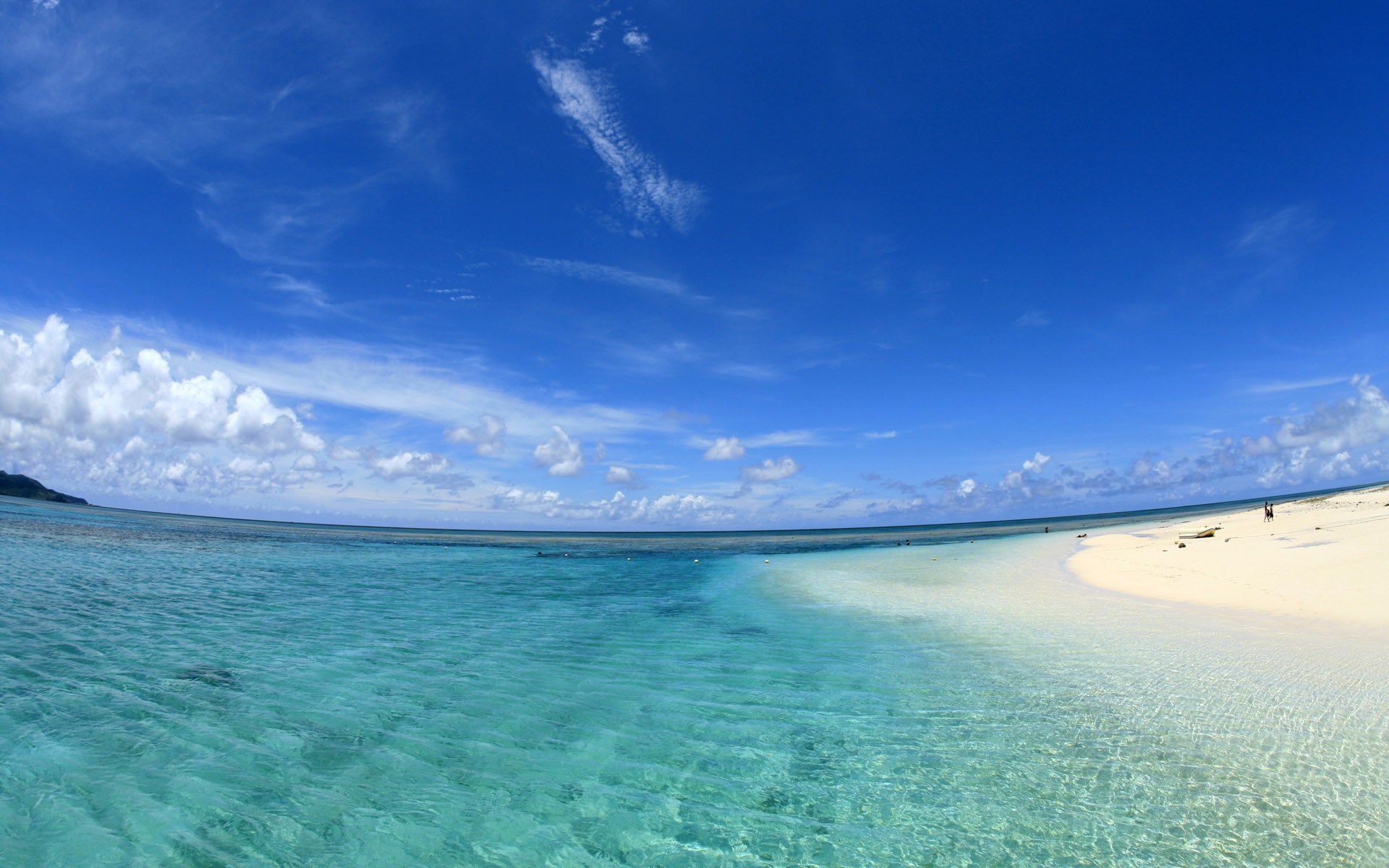 Turquoise ocean and white sand beach under blue sky HD Wallpaper