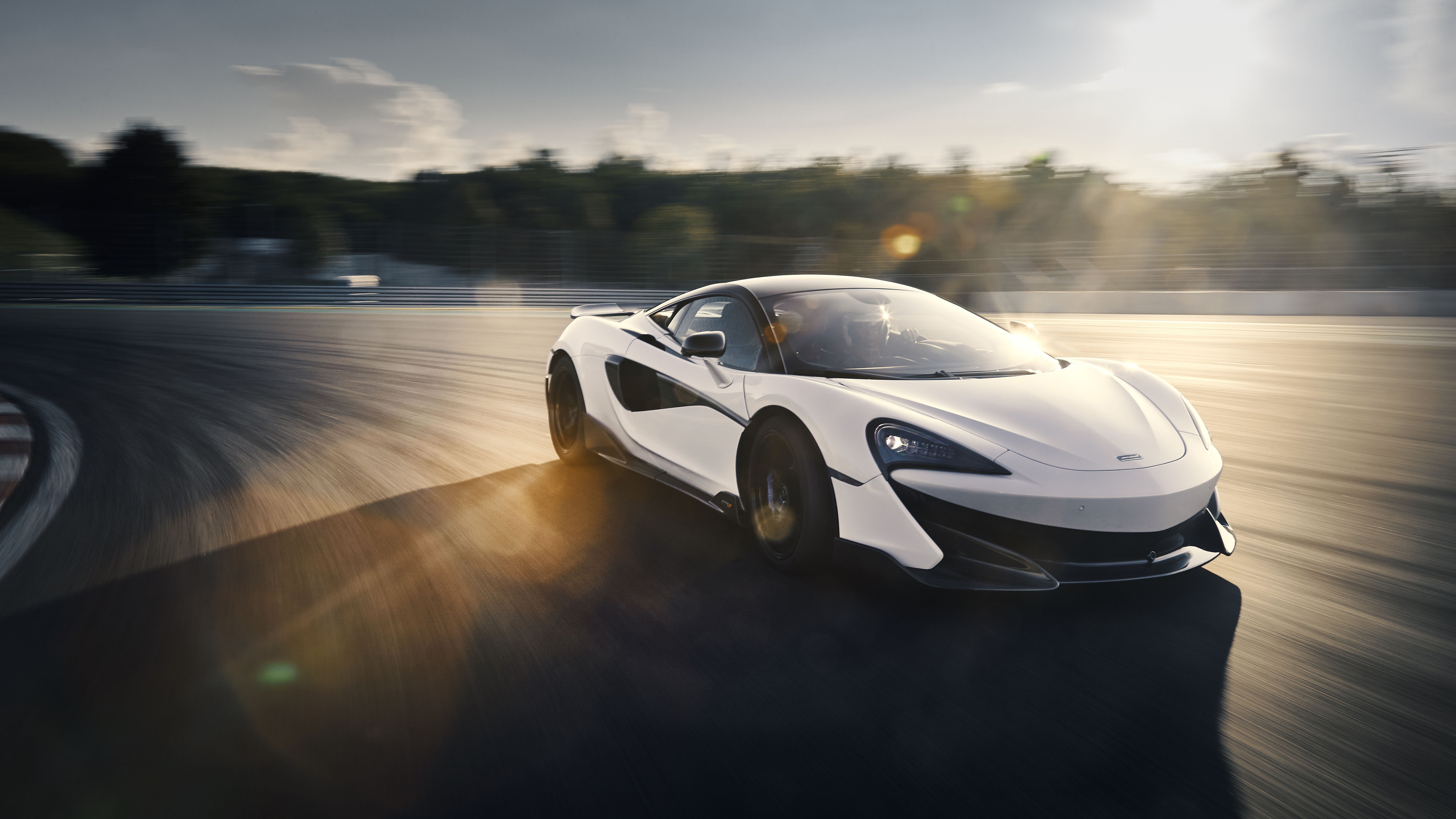 White McLaren 600LT Supercar on a Racetrack HD Wallpaper