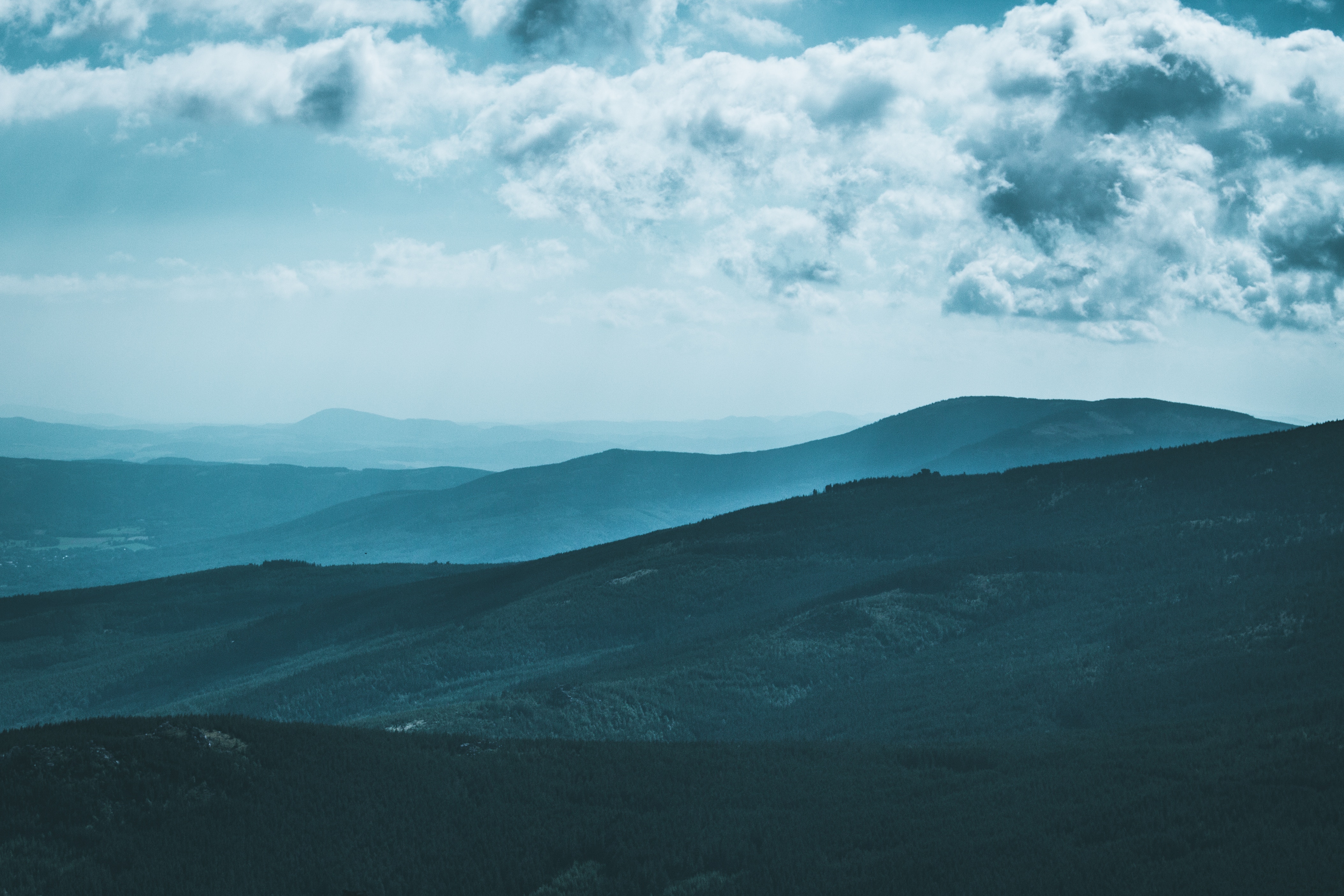 Mountain range with moody sky HD Wallpaper