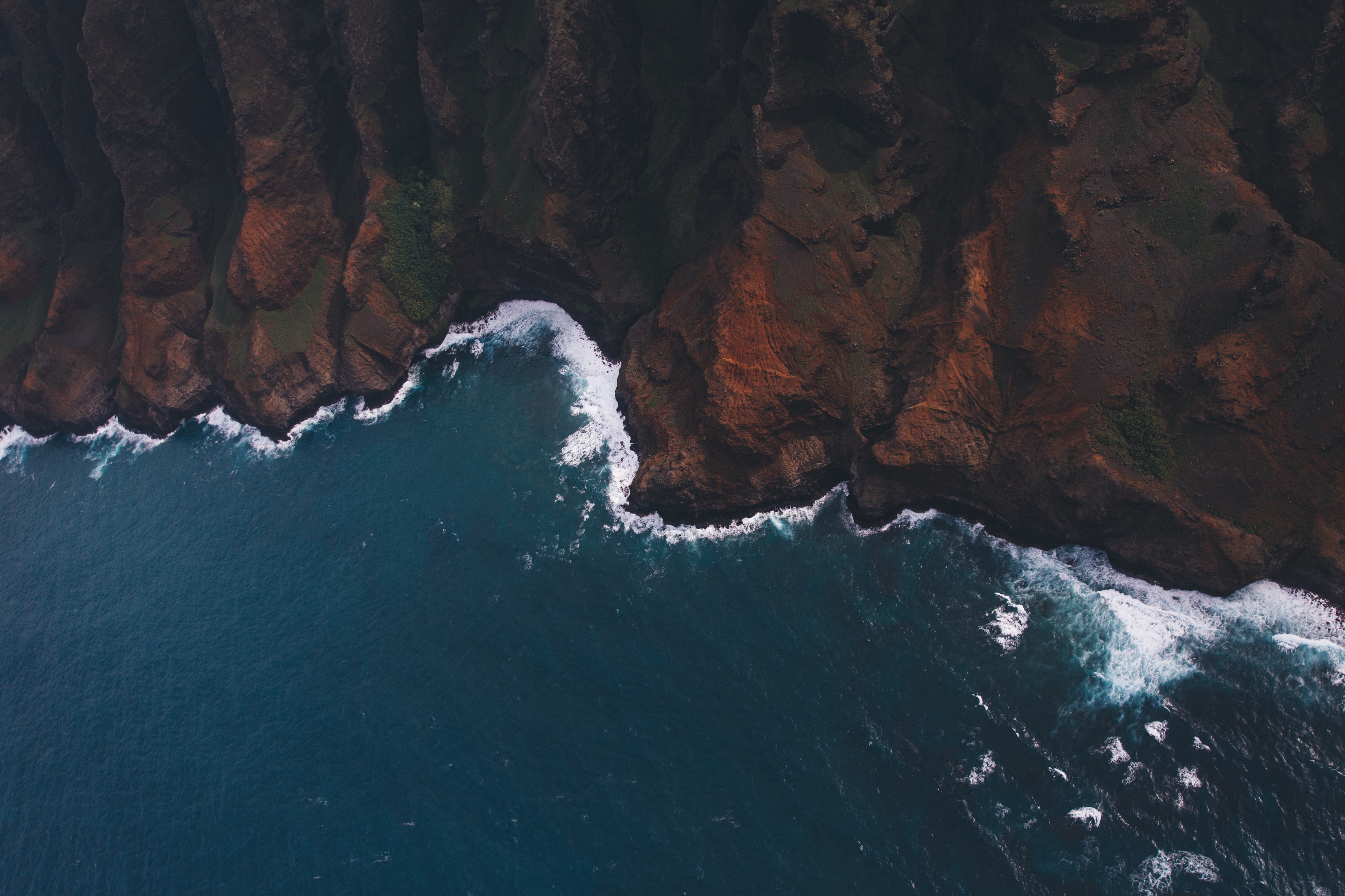 Aerial View of Rocky Coastline with Ocean Waves HD Wallpaper