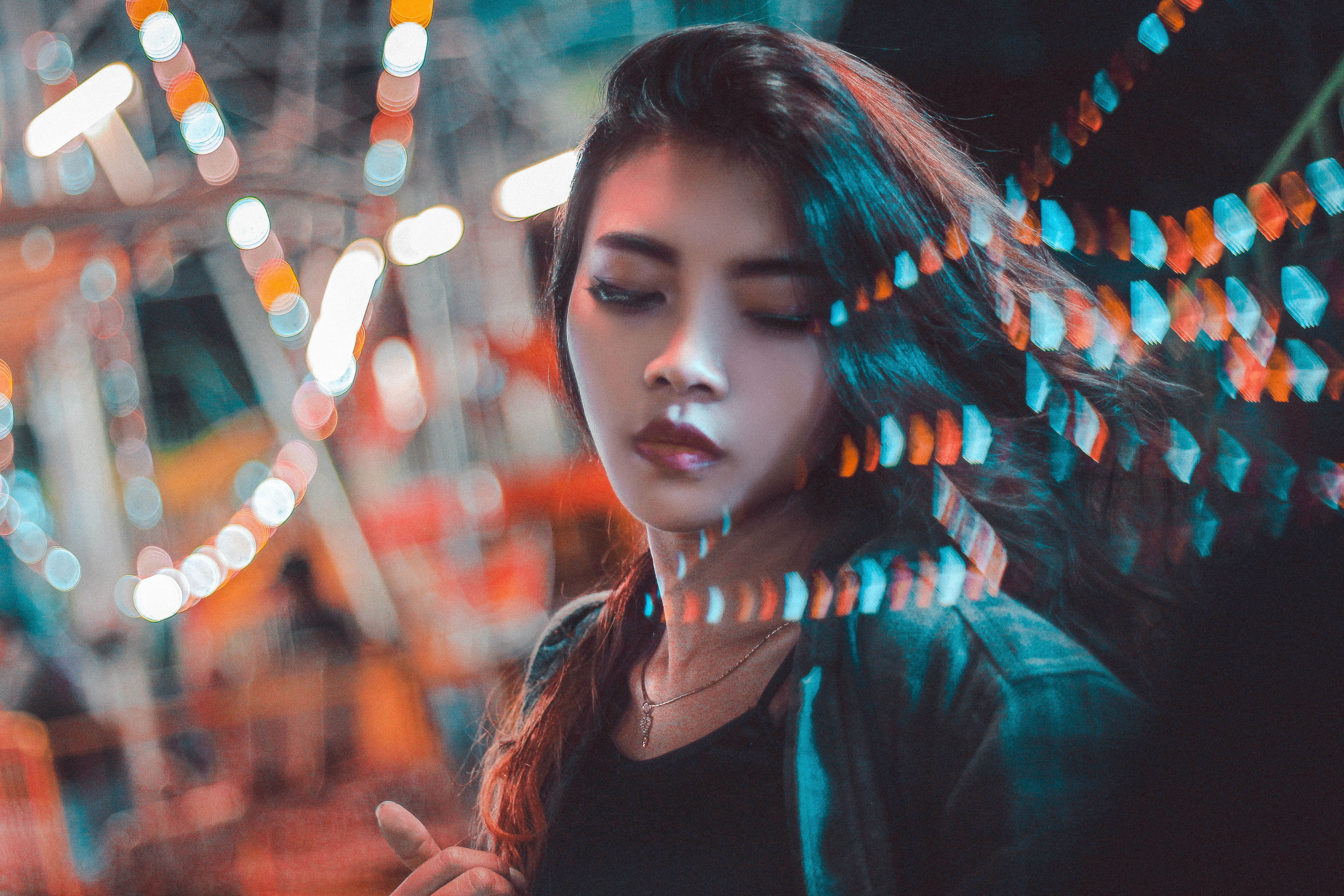 Woman with bokeh lights in the city at night HD Wallpaper