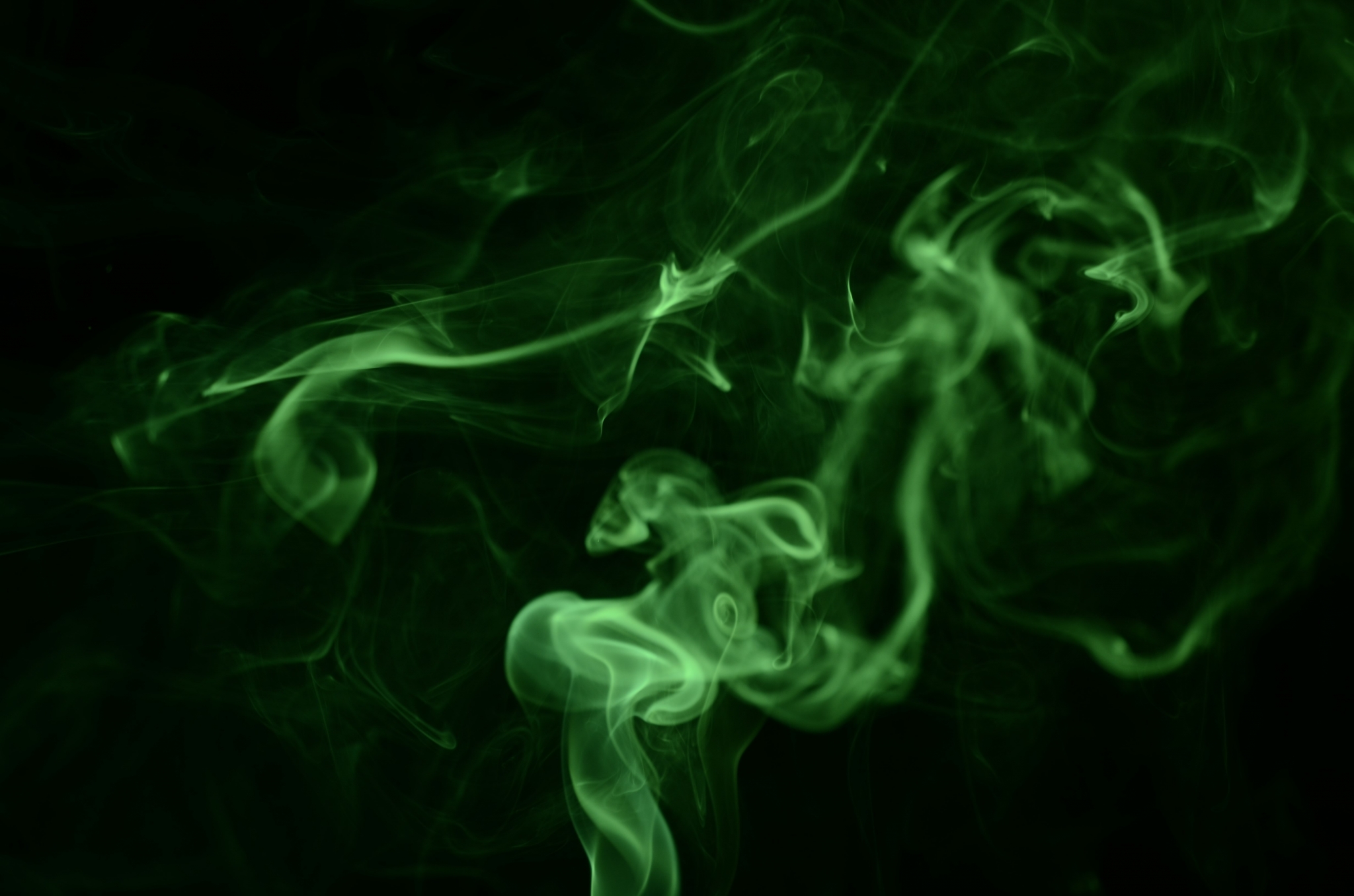 Green smoke swirling against black HD Wallpaper