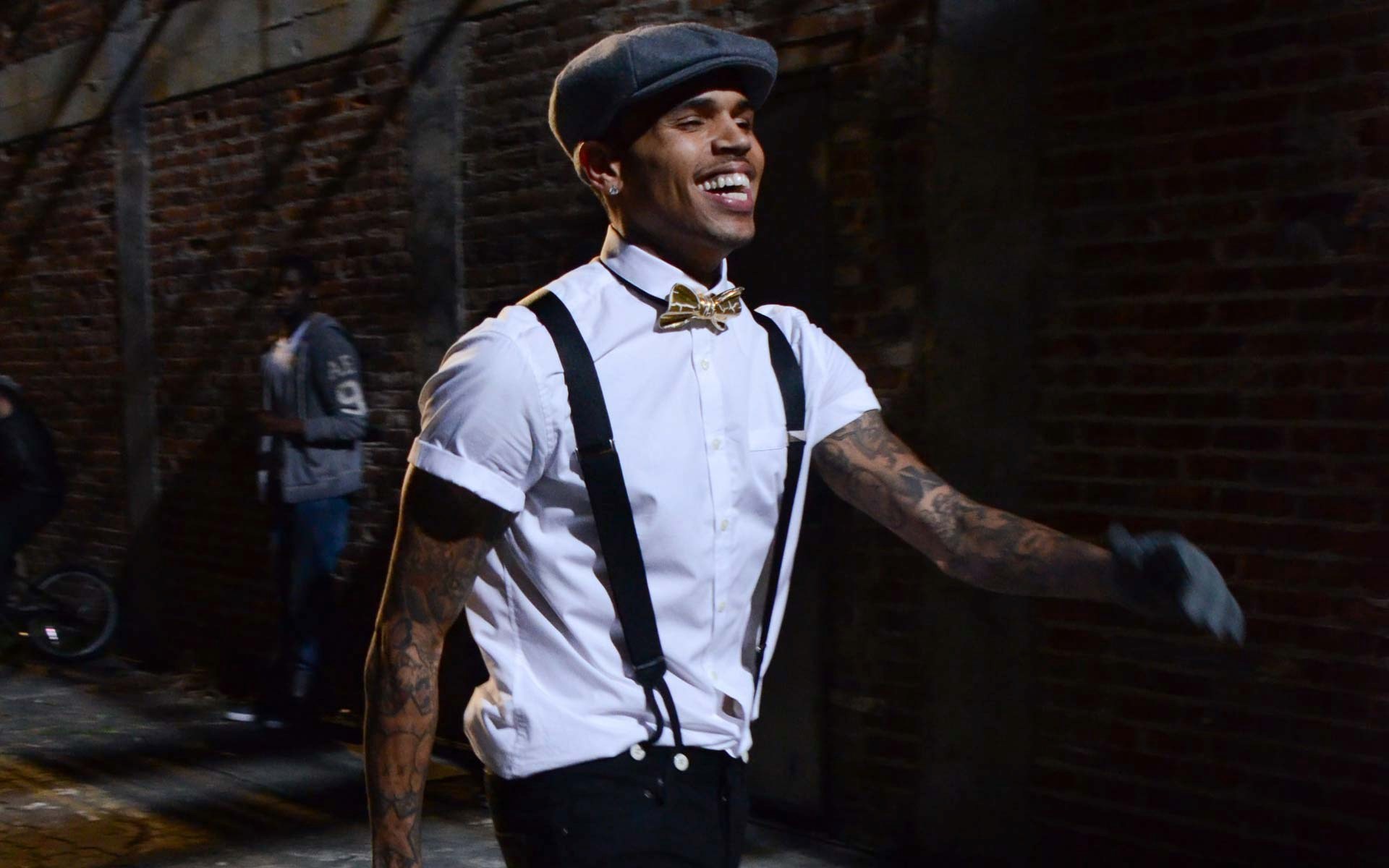 Chris Brown wearing suspenders and a bow tie HD Wallpaper