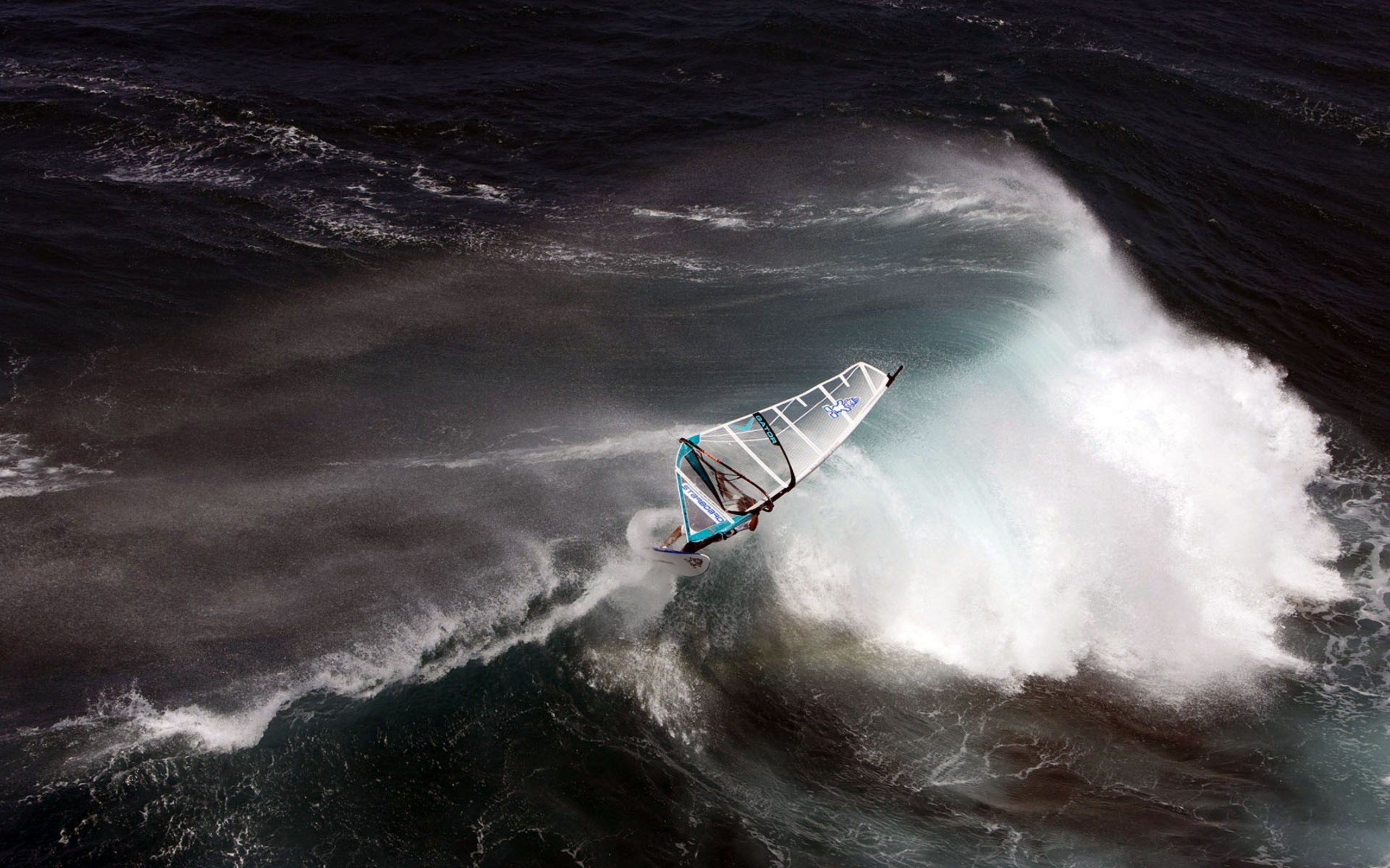 Windsurfer jumping on a large wave HD Wallpaper