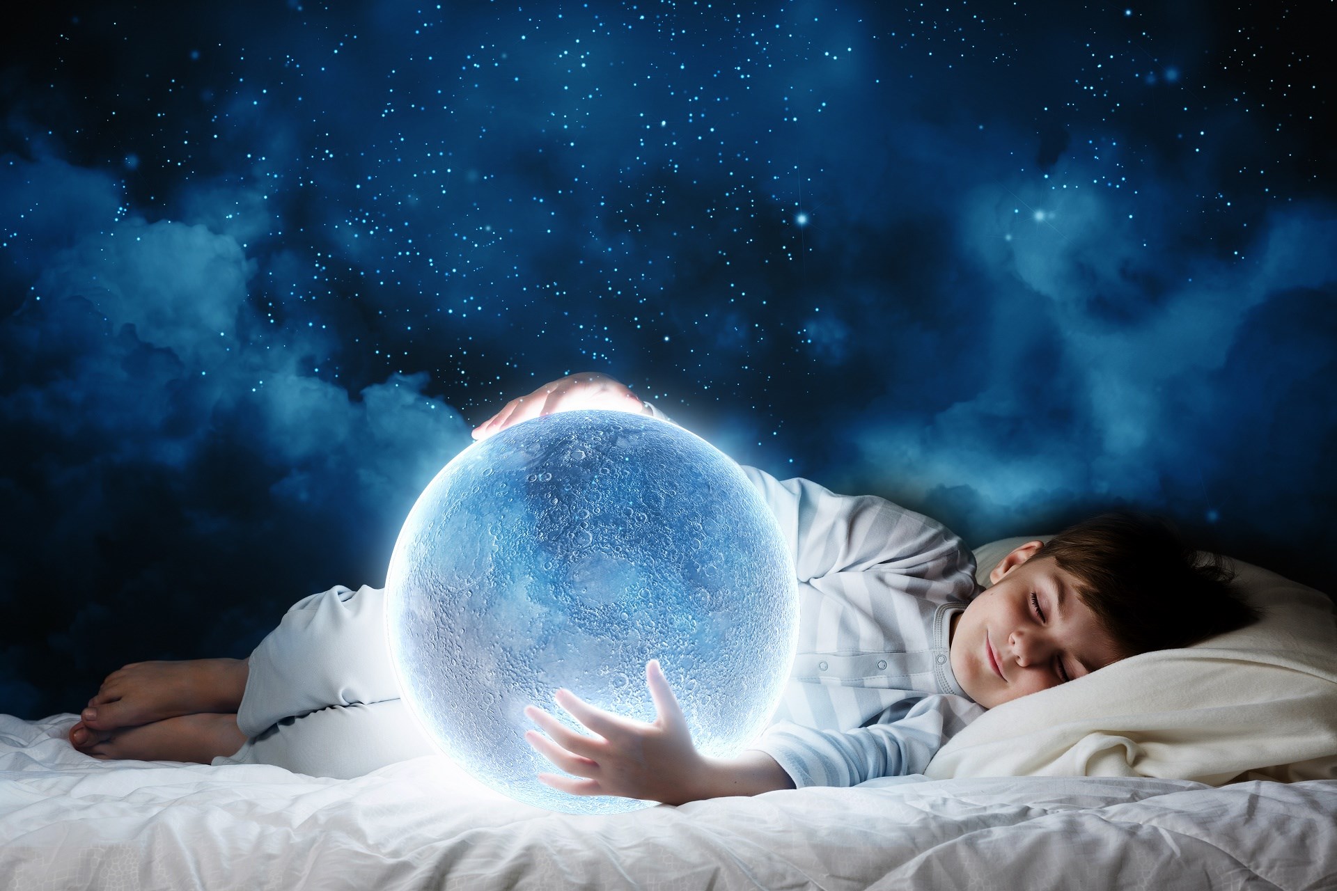 Boy sleeping and holding a glowing moon HD Wallpaper