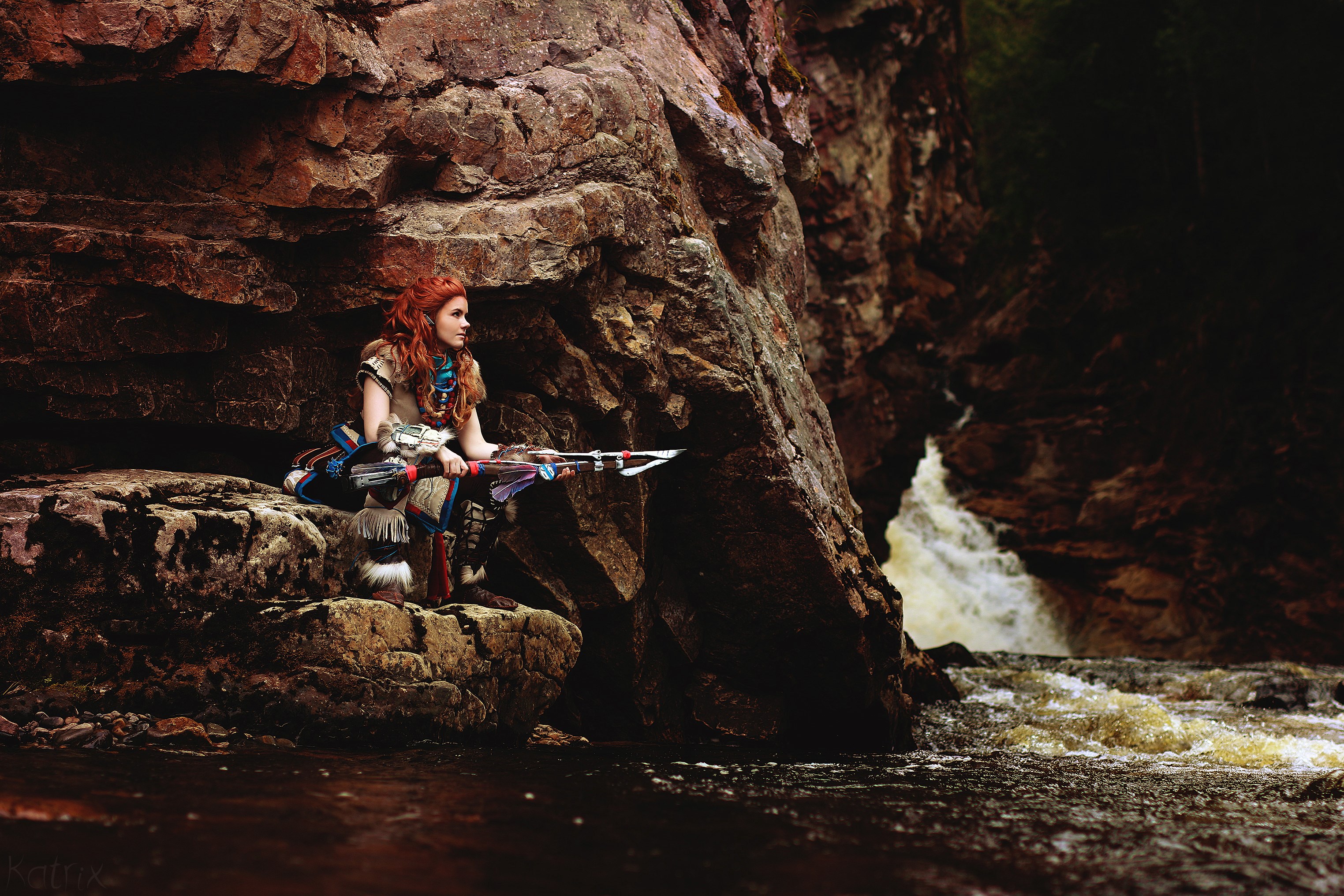 Aloy from Horizon Zero Dawn cosplay by a waterfall HD Wallpaper