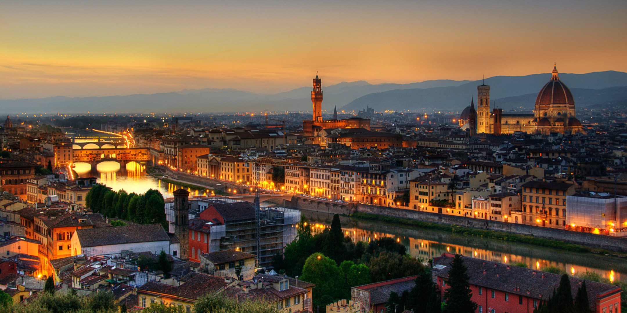 Florence cityscape with Arno River and Ponte Vecchio at dusk HD Wallpaper