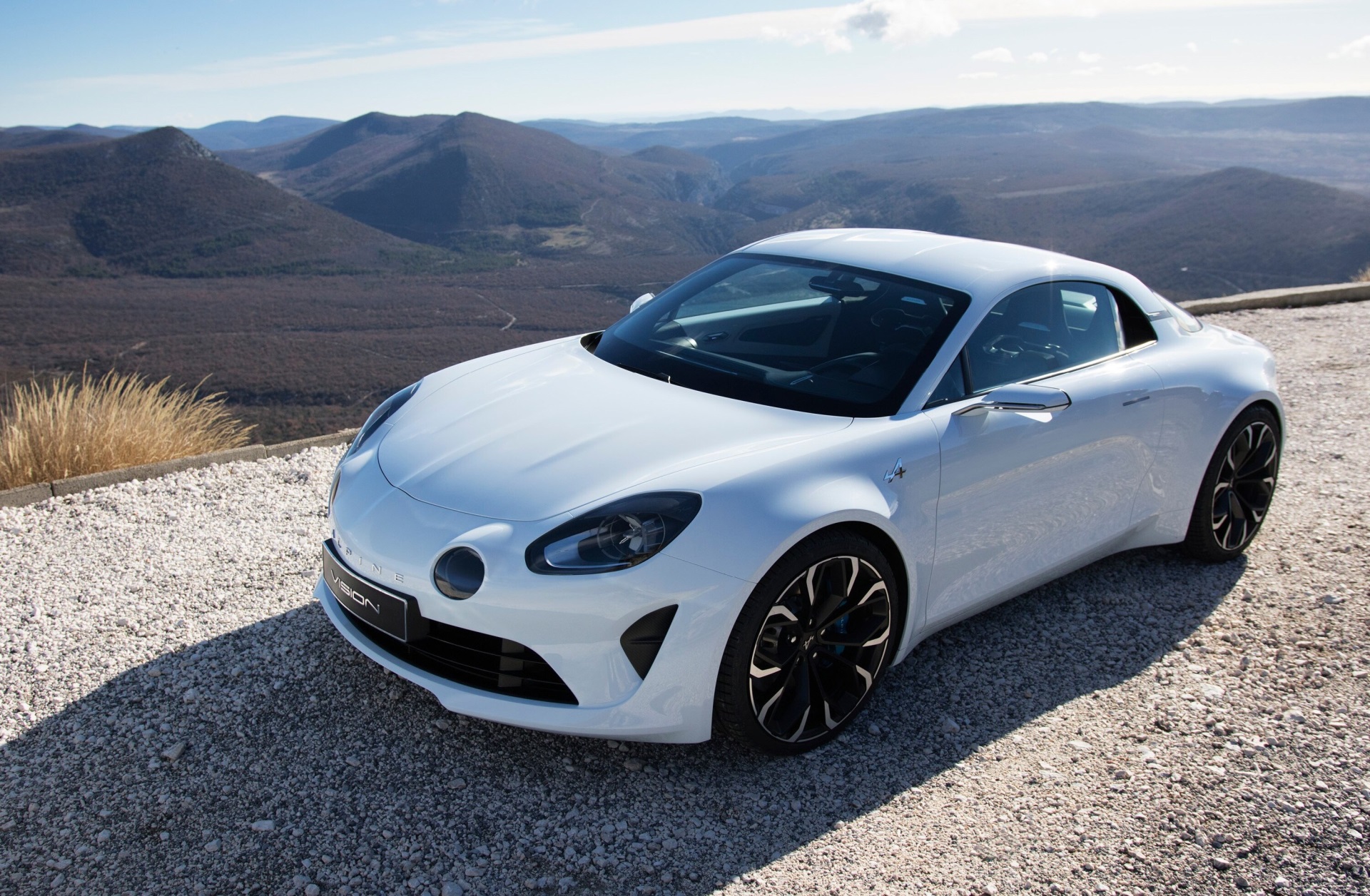 White Alpine A110 car on gravel road HD Wallpaper