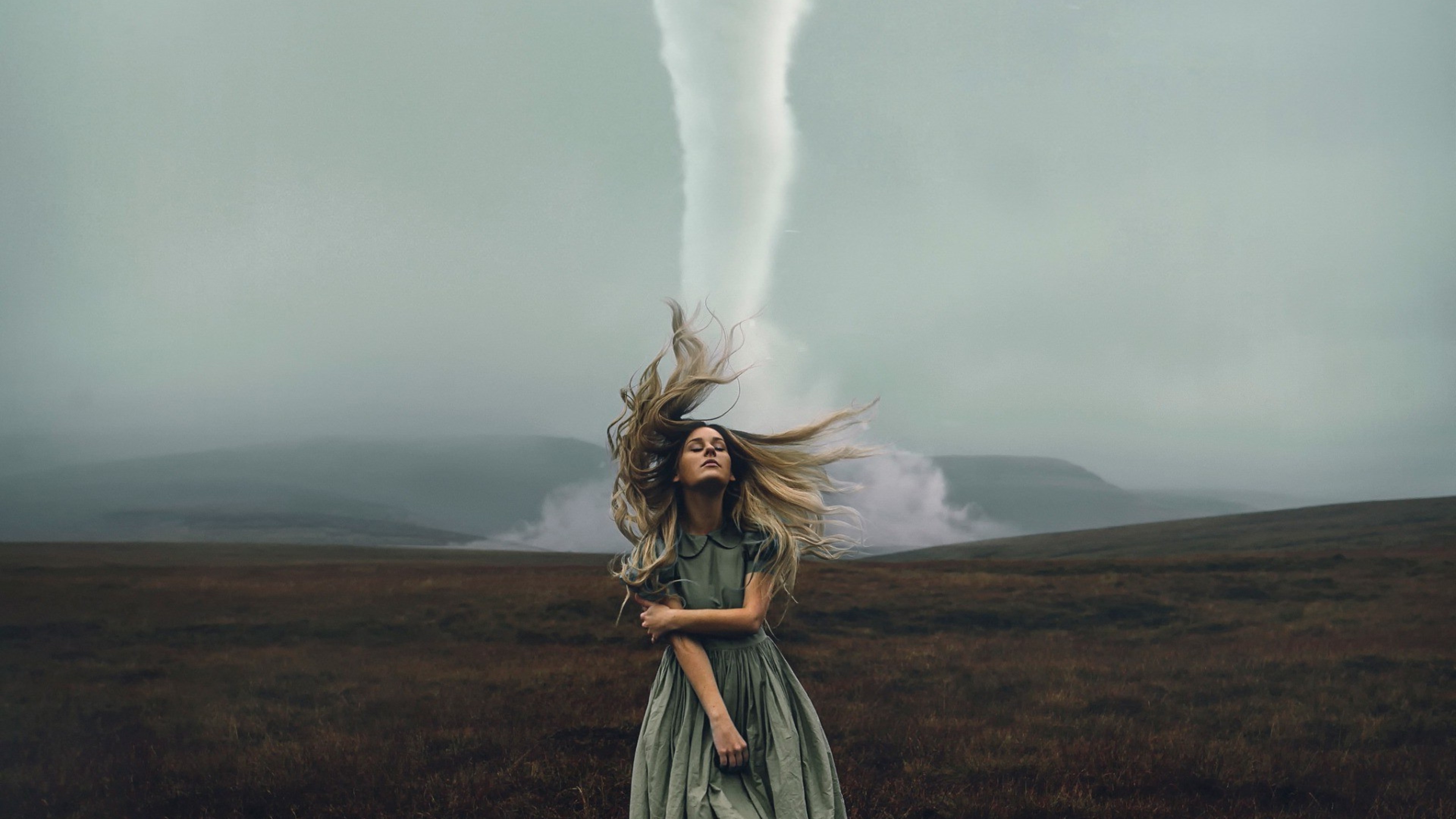 Woman with tornado in field 4K HD Wallpaper