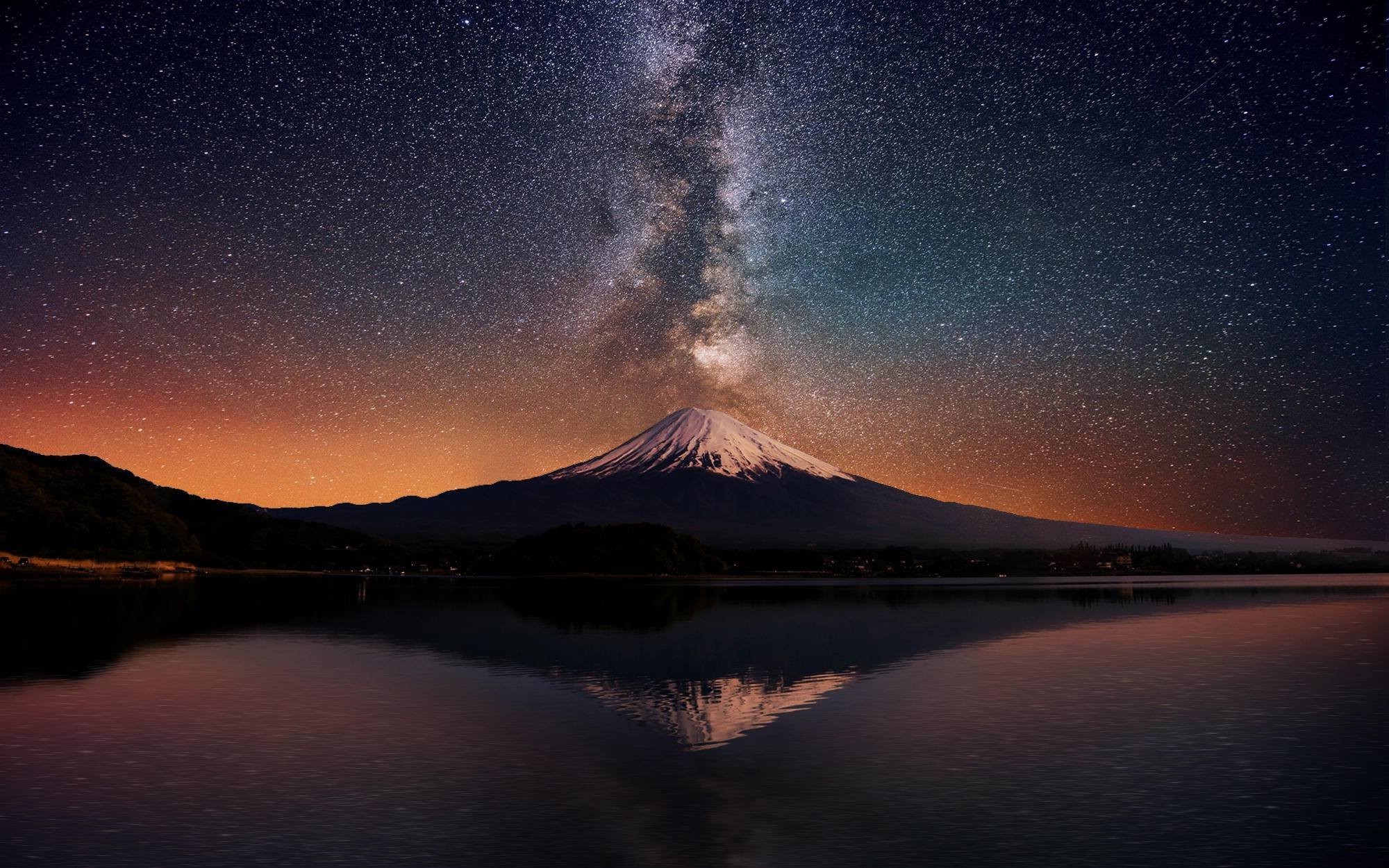 Mount Fuji under the Milky Way reflected in a lake HD Wallpaper