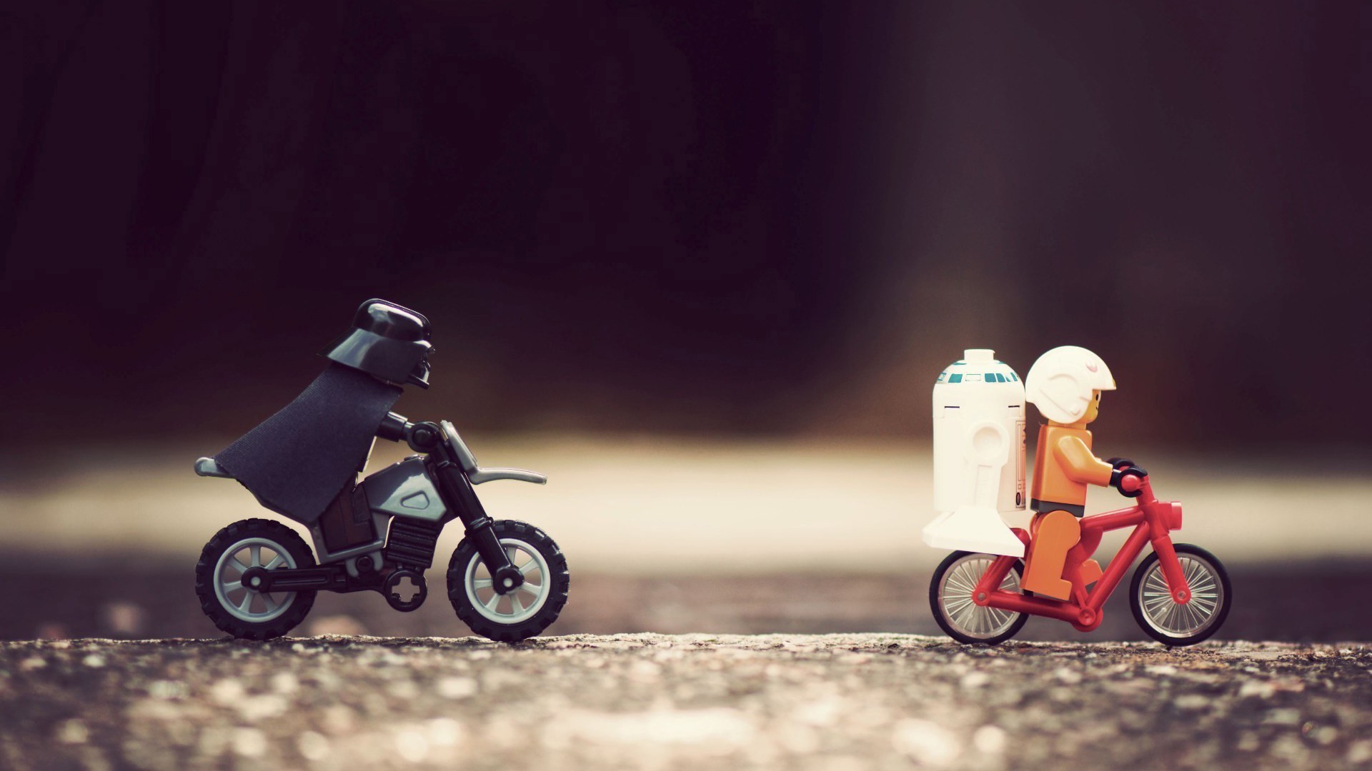 Darth Vader and R2-D2 Lego figures on bikes HD Wallpaper
