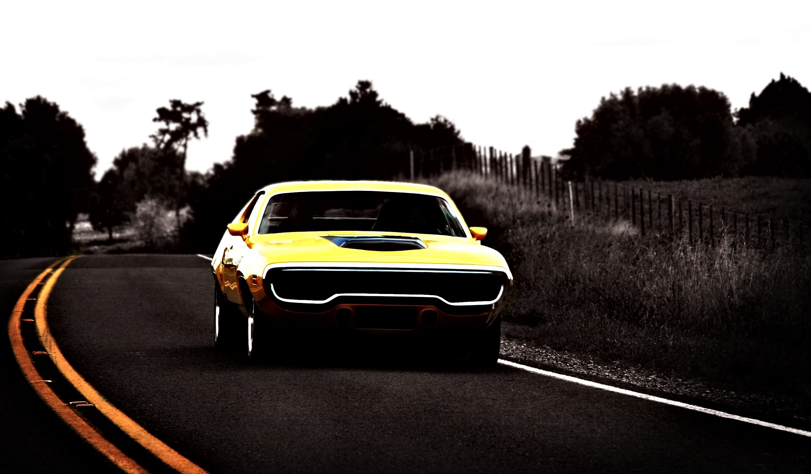 Yellow muscle car on a road HD Wallpaper