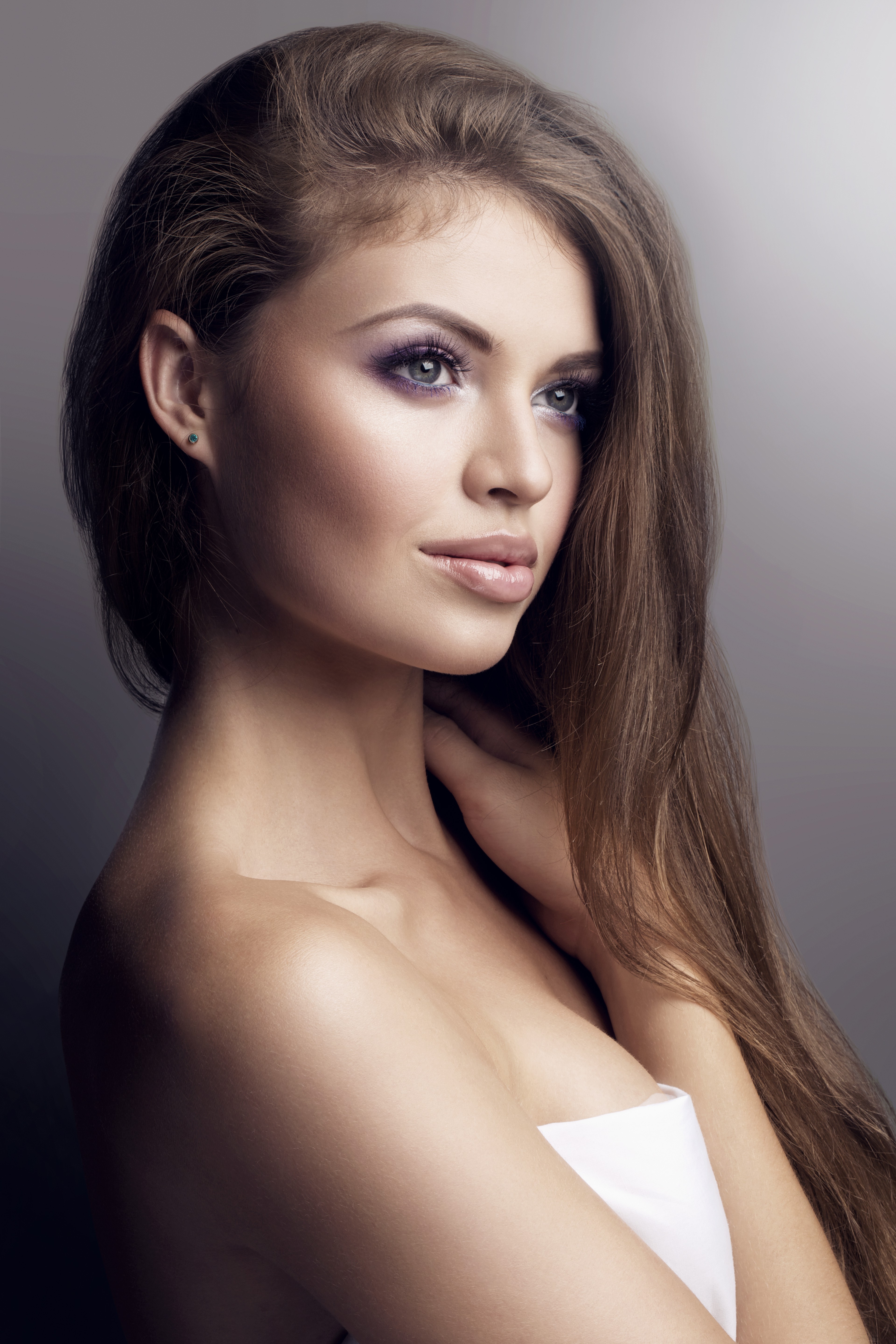Woman with purple eyeshadow and long brown hair HD Wallpaper