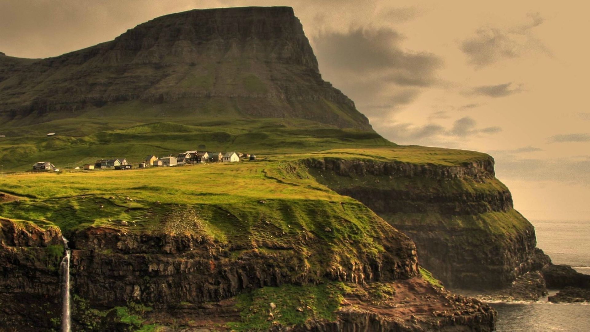 Village on a cliffside in the Faroe Islands HD Wallpaper