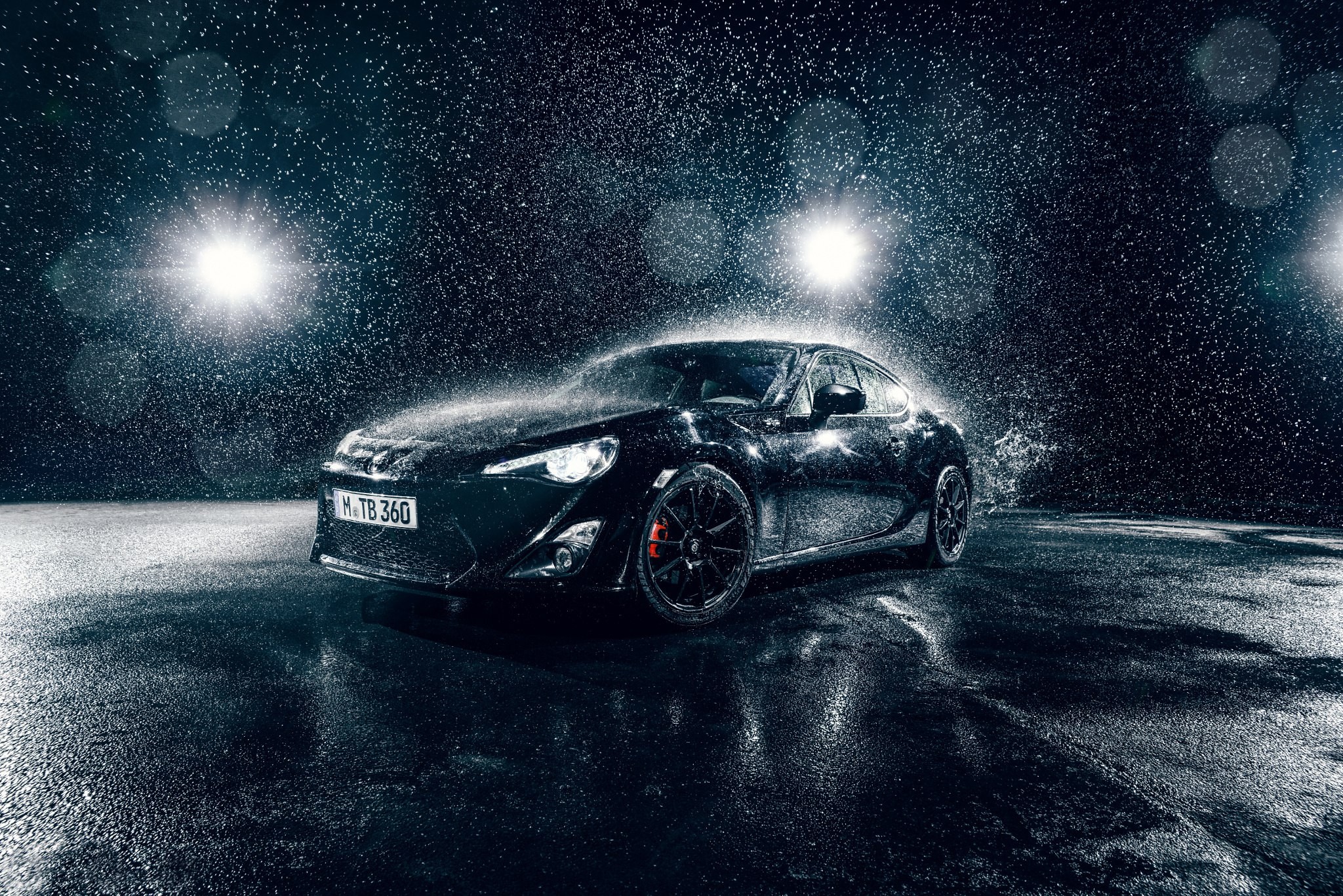 Black Toyota 86 in rain with lights HD Wallpaper