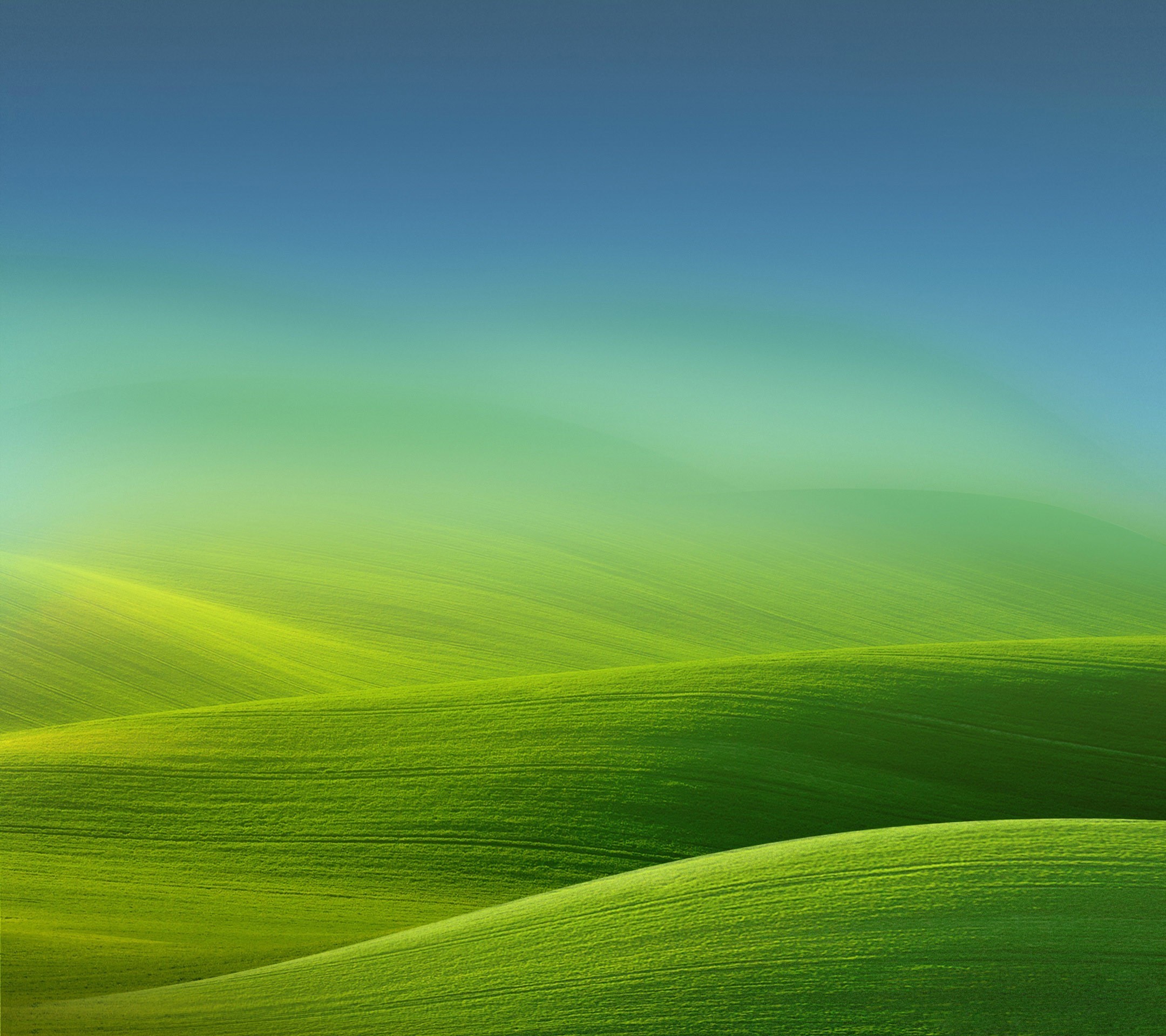 Green rolling hills with a blue sky gradient HD Wallpaper