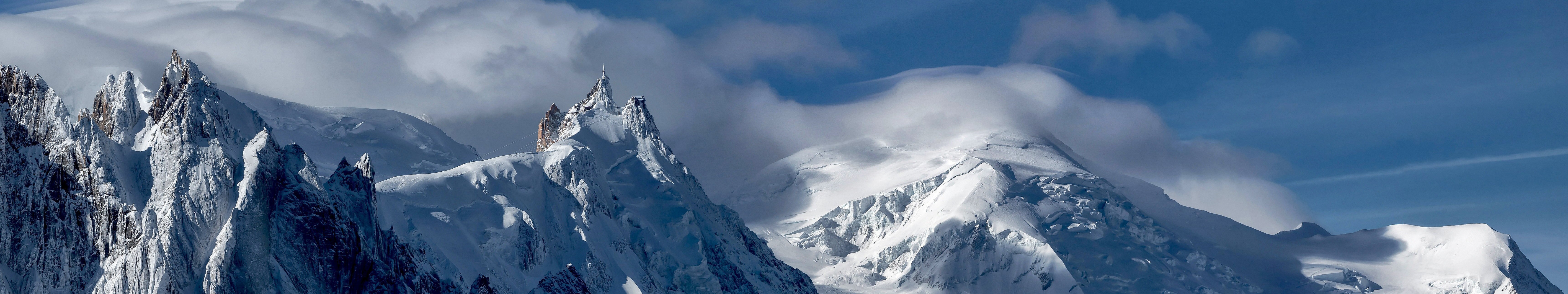 Snowy mountain landscape with clouds HD Wallpaper