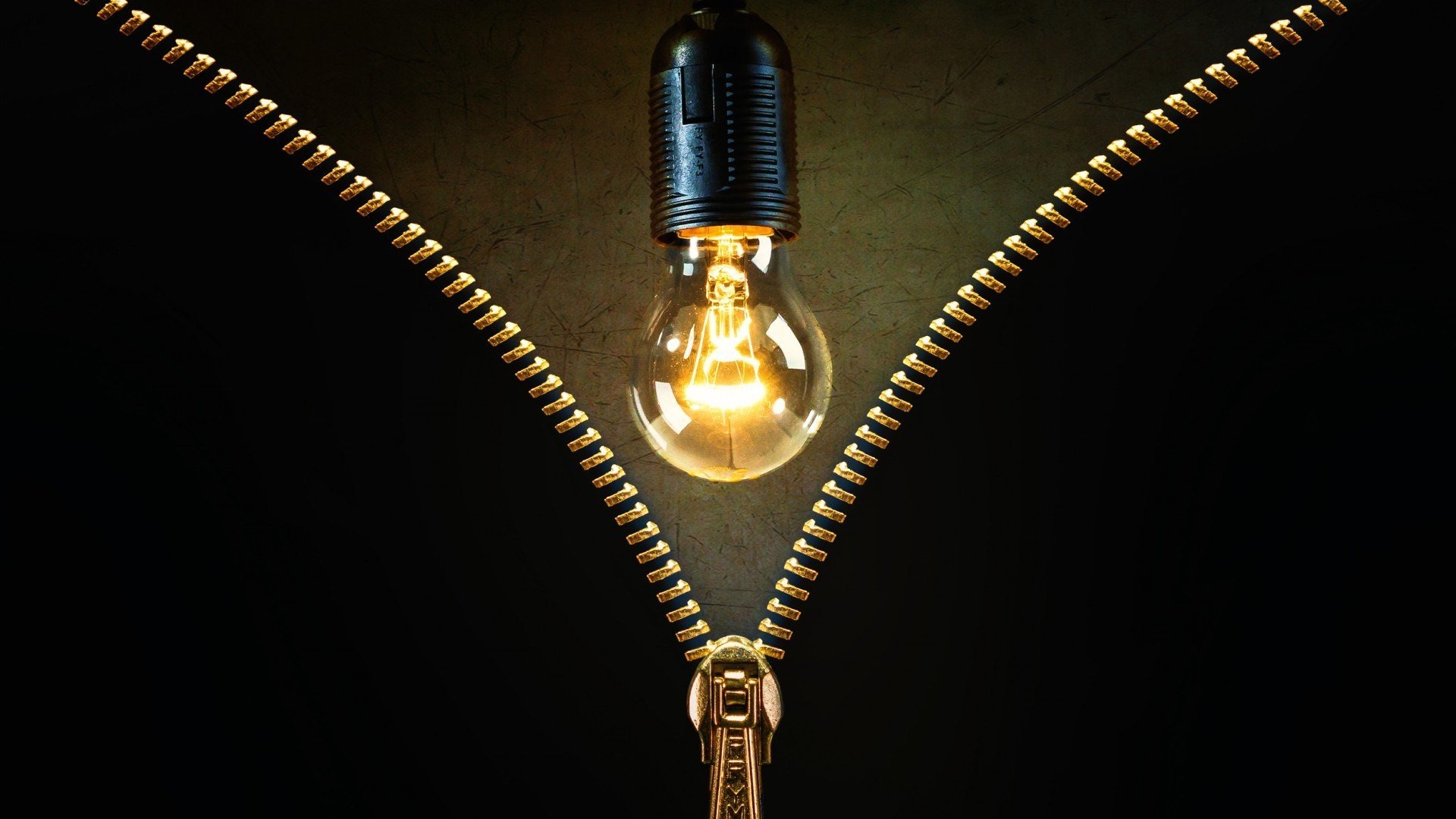 Lightbulb behind a zipper HD Wallpaper