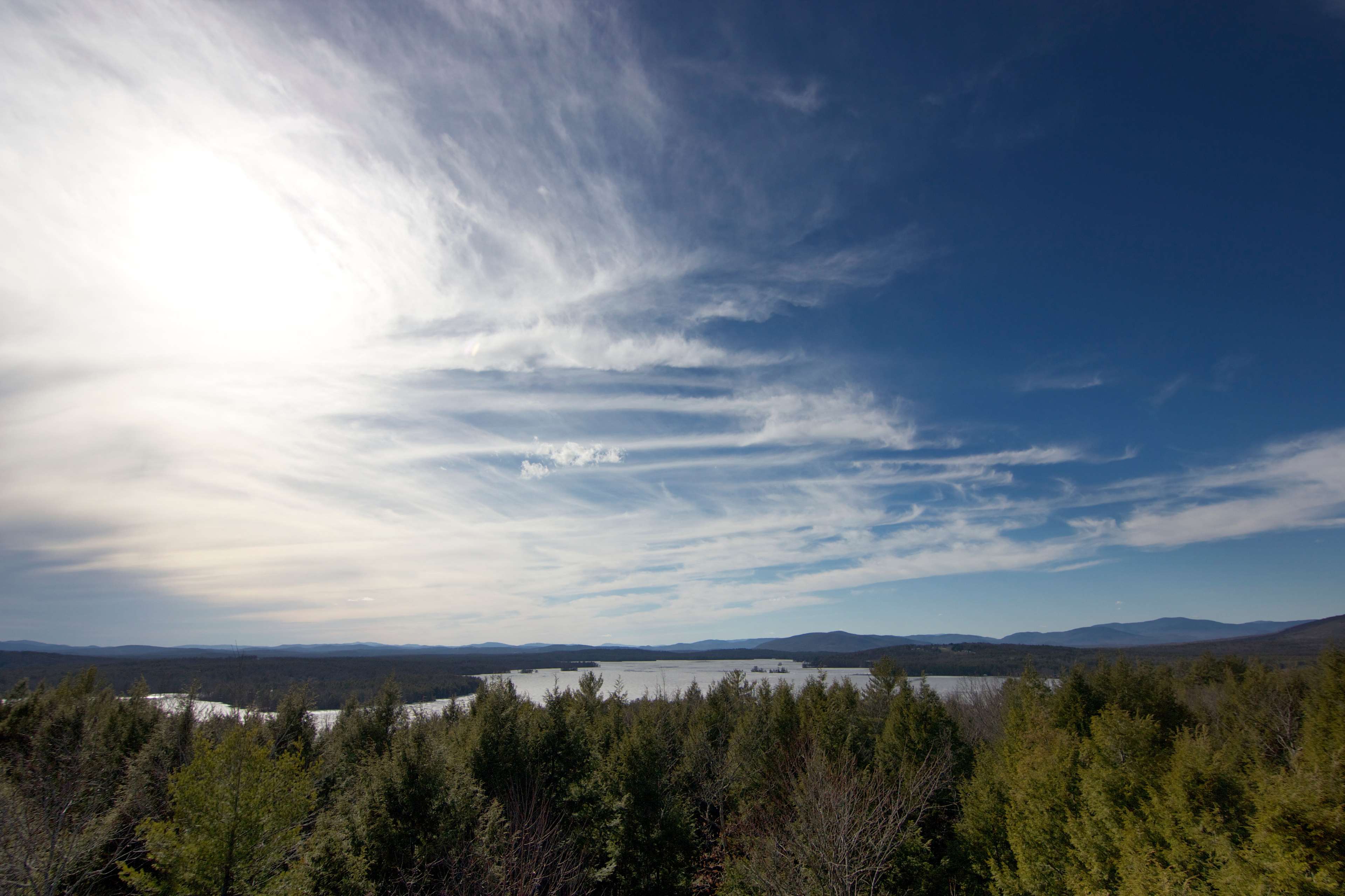 Landscape with lake and forest under a cloudy sky HD Wallpaper