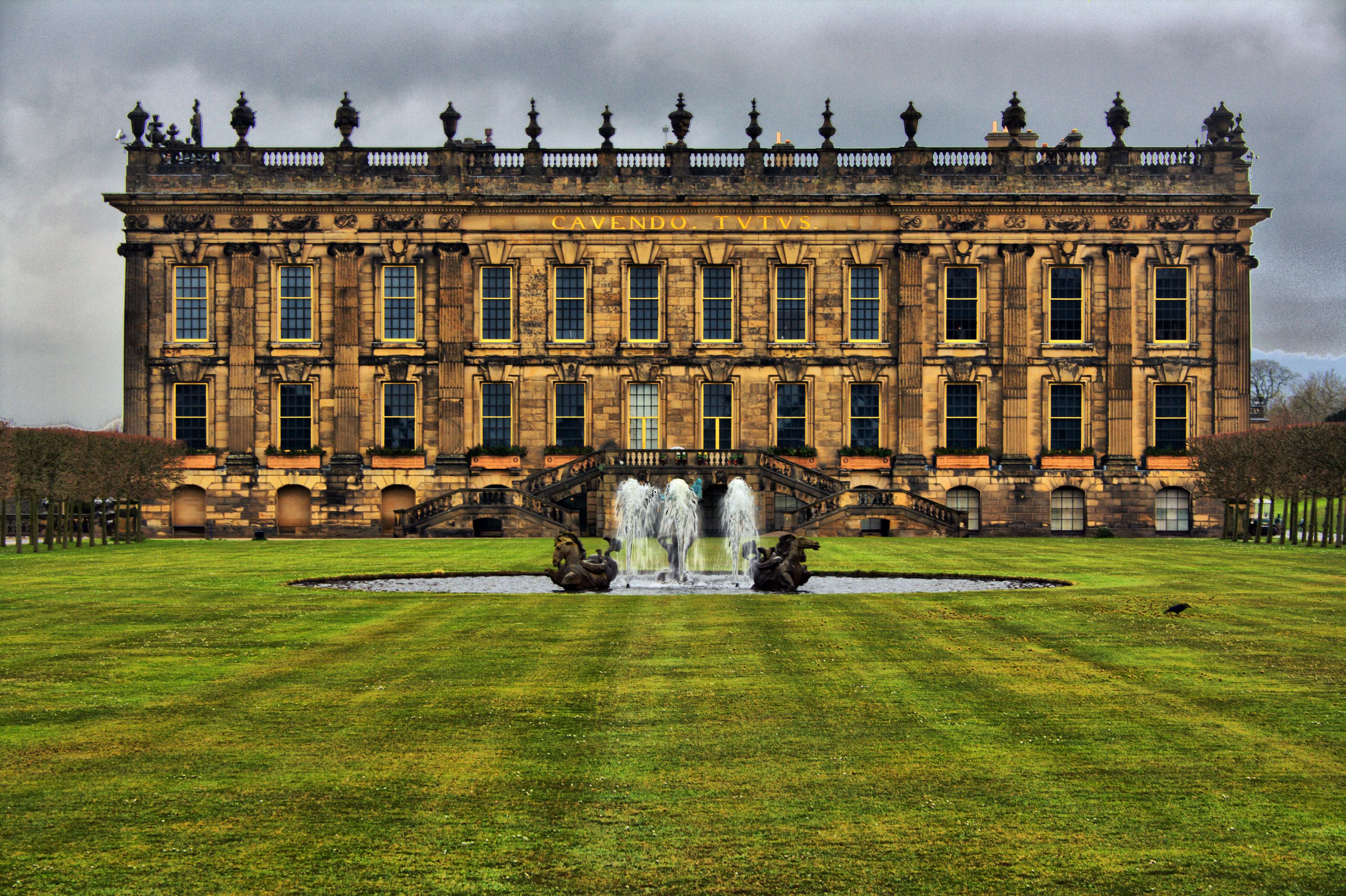 Chatsworth House with fountain and grass lawn 4K HD Wallpaper