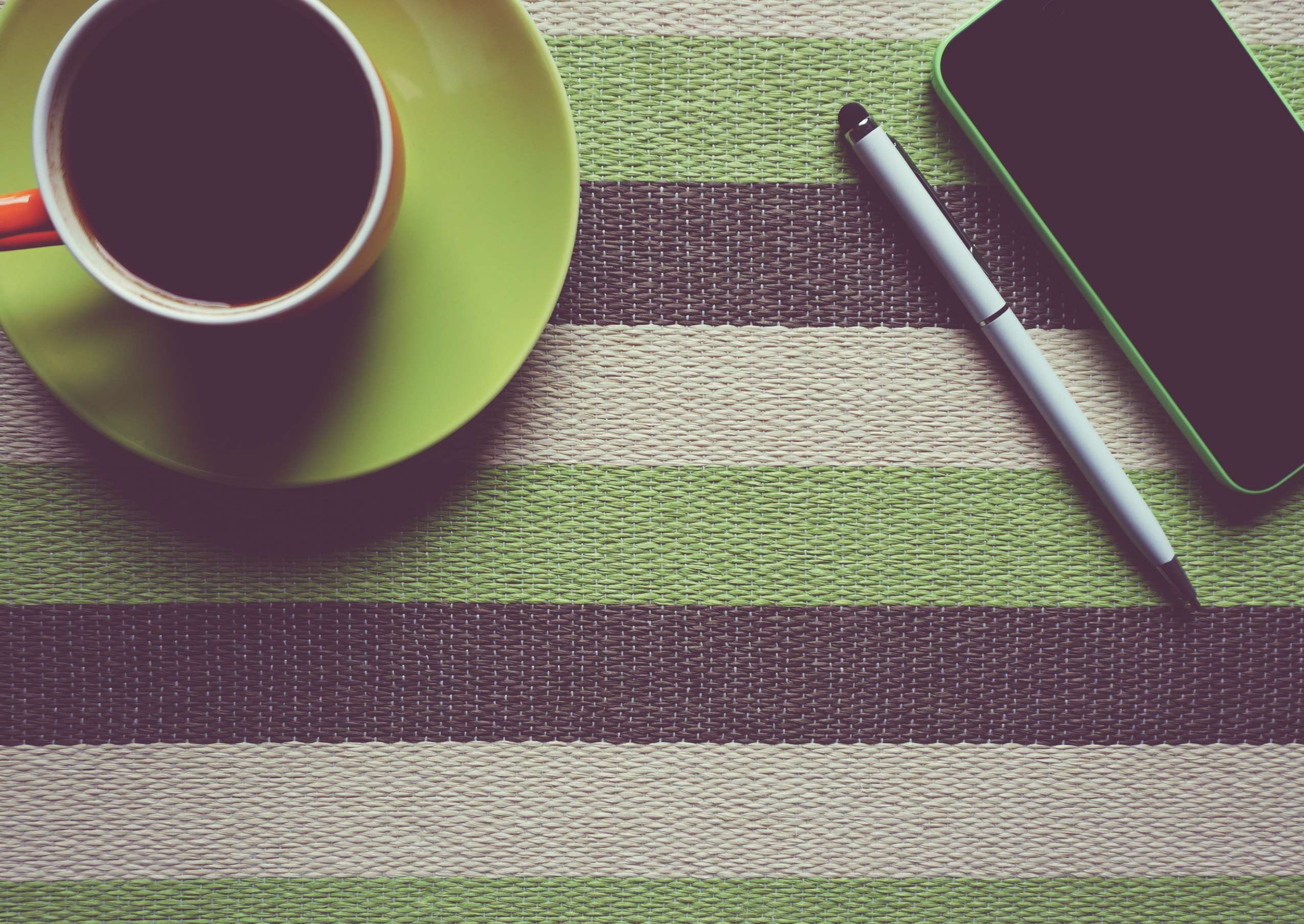 Coffee cup, pen, and smartphone on striped surface HD Wallpaper