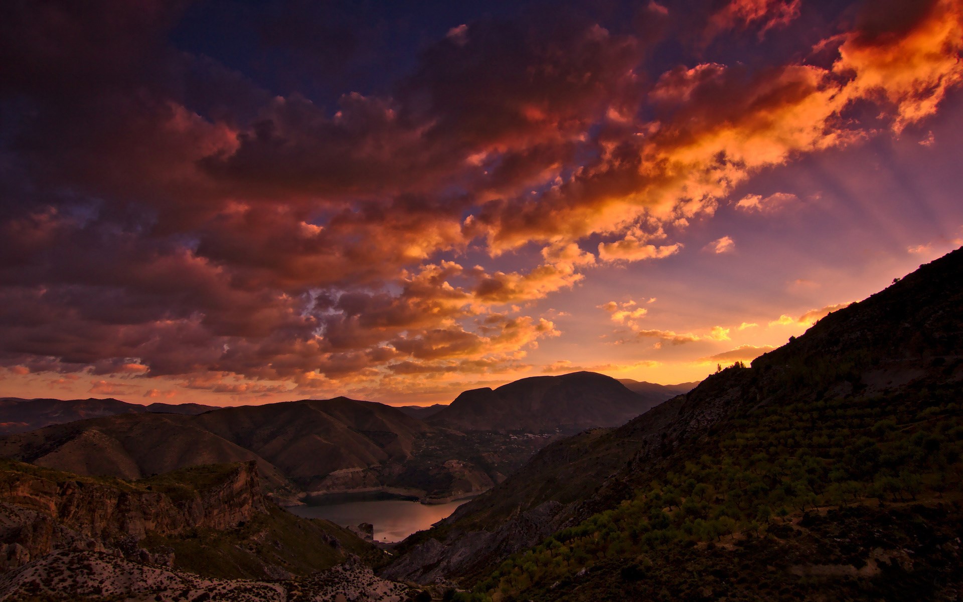 Sunset over mountains and a lake HD Wallpaper