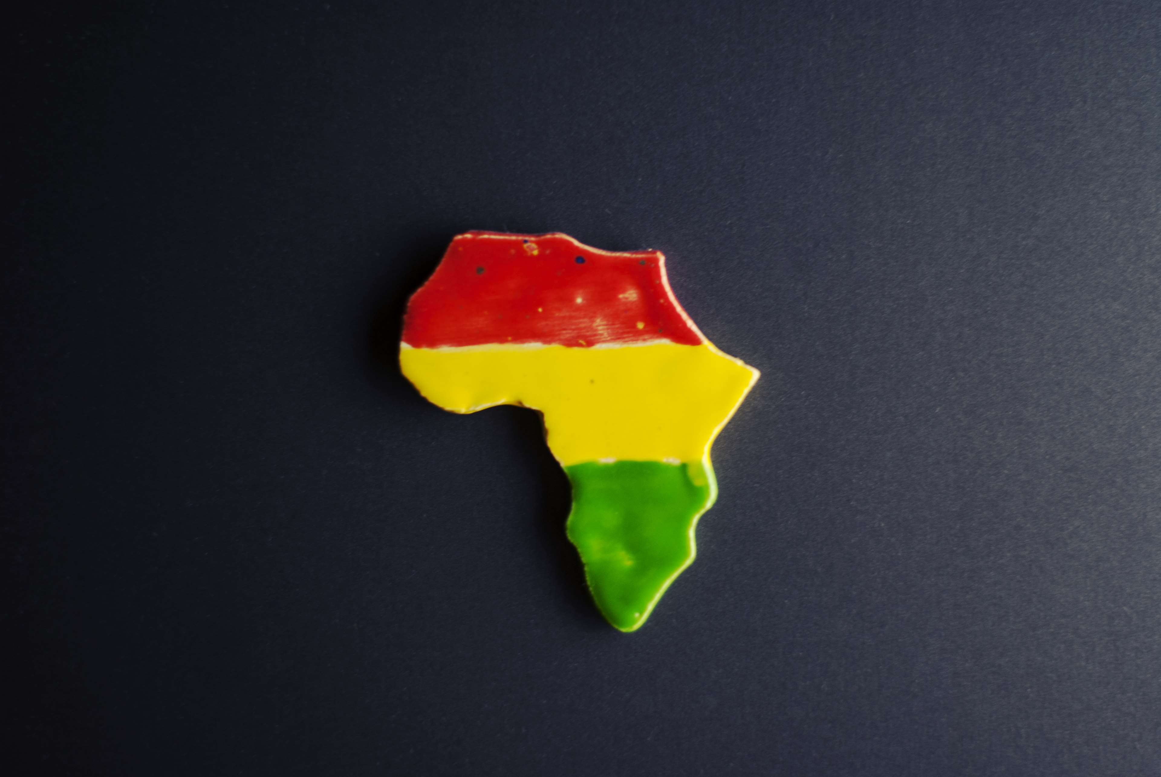 Africa continent map with red, yellow, and green colors HD Wallpaper
